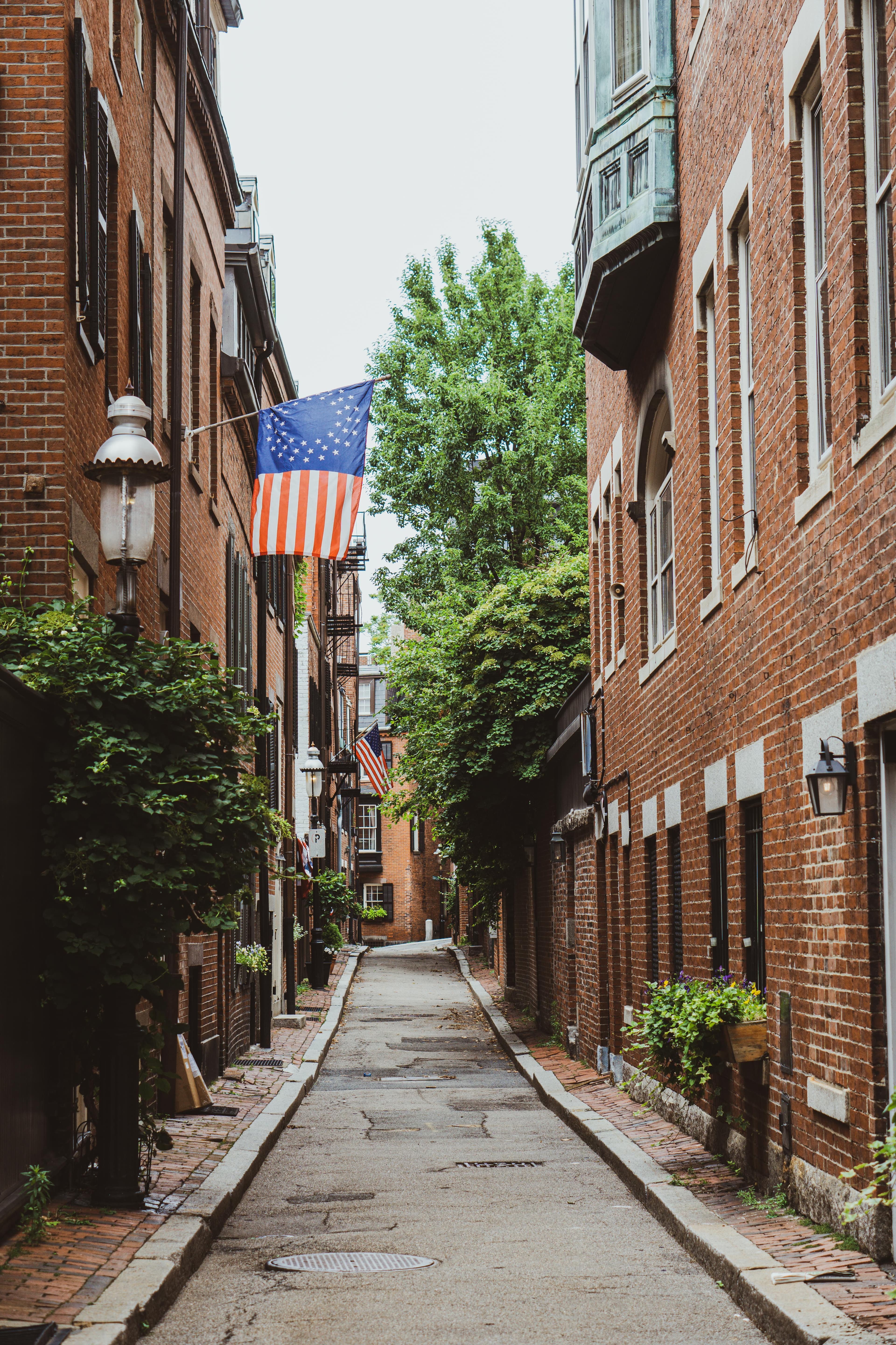 Street lined with brick buildings during daytime