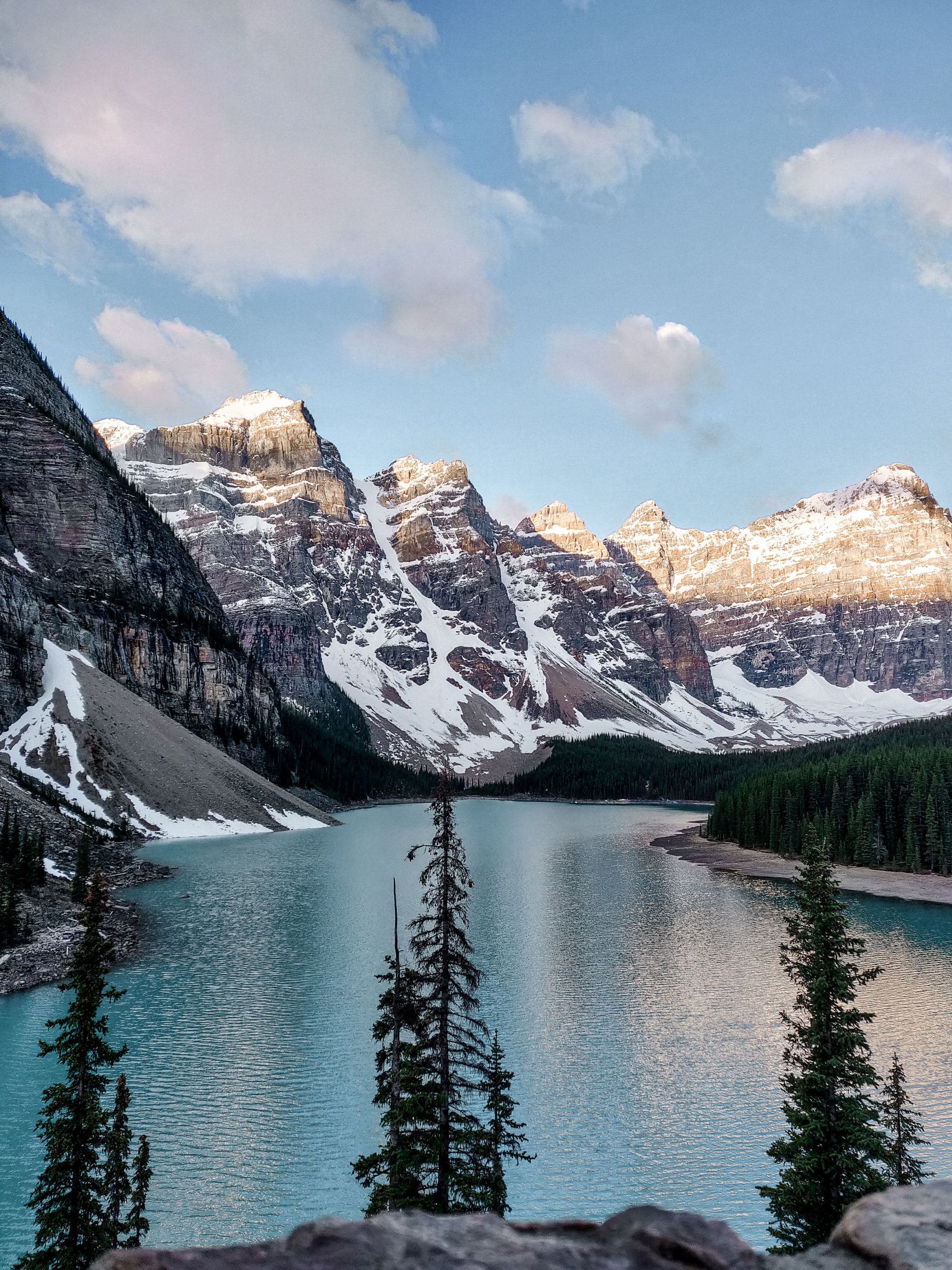 snow mountains over a blue lake in winter