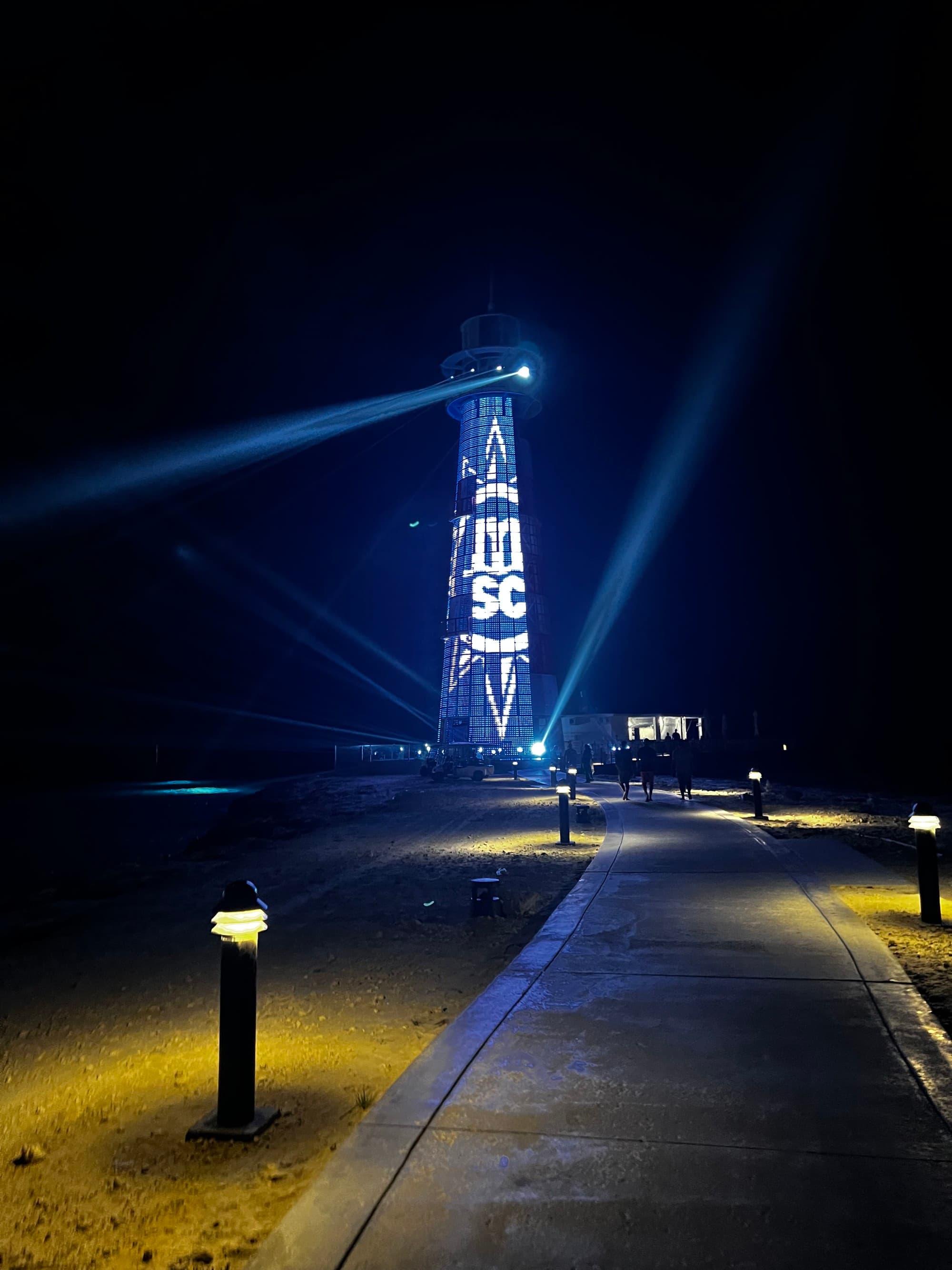 A picture of Cay lighthouse show during nightime