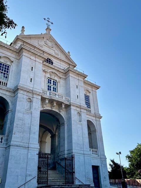 Lisbon Church stands tall against the clear sky on a sunny day.