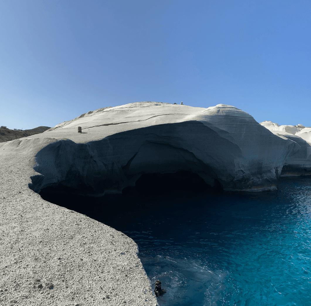 Sarakiniko Beach's unique white volcanic rock formations and crystal-clear waters.