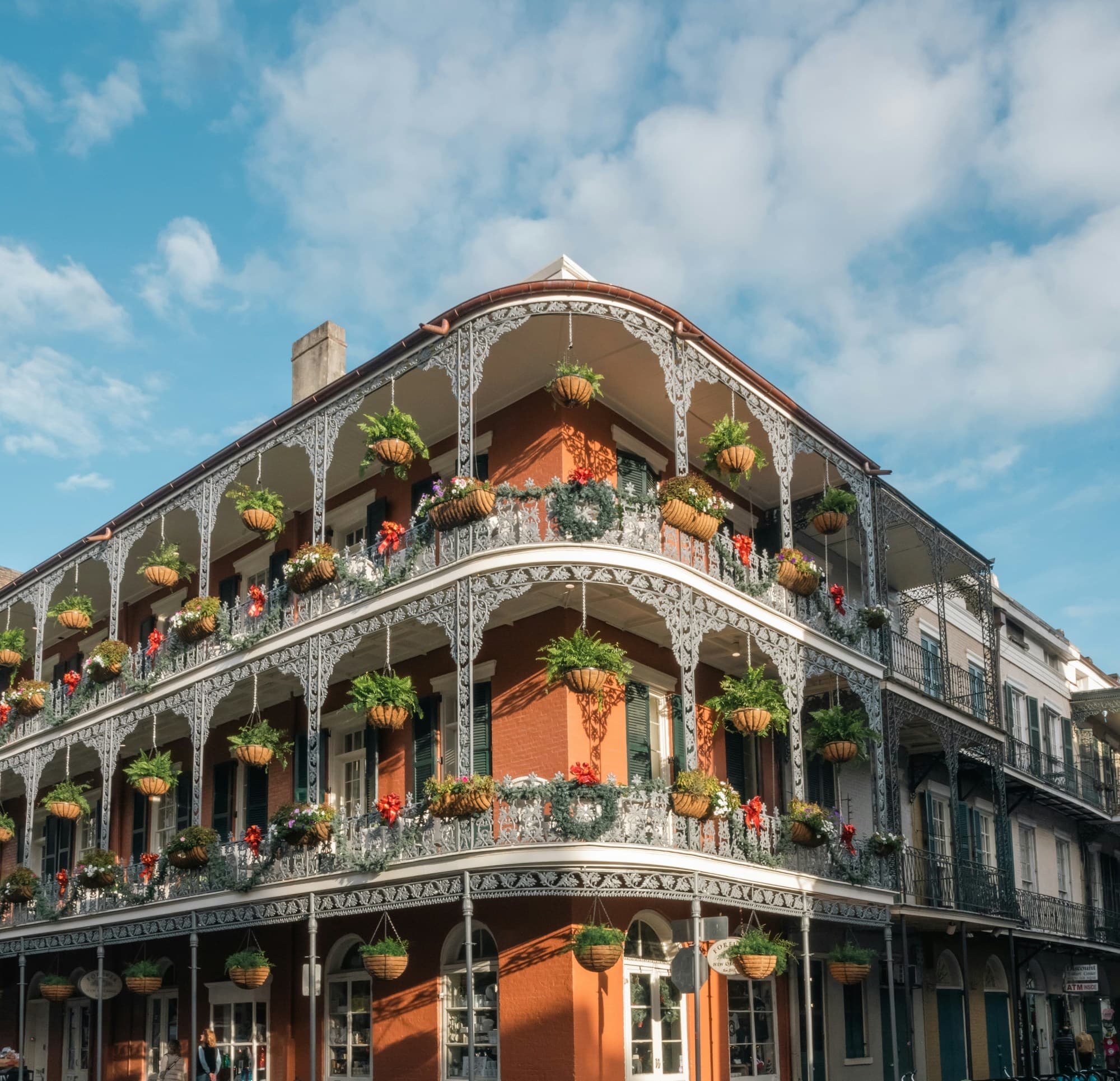 A building with balconies and flowers.