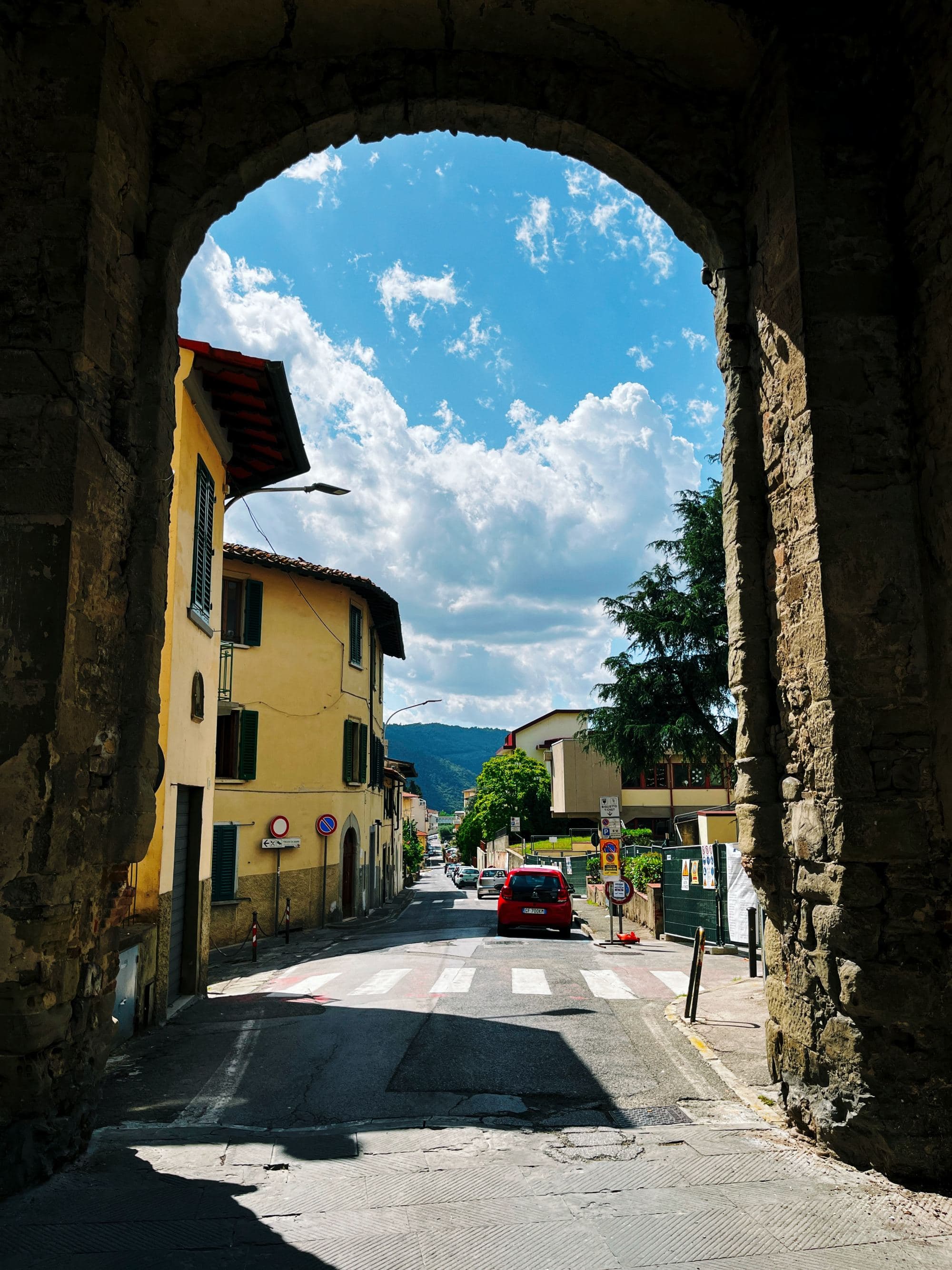 Looking through the arches of a small Italian town.