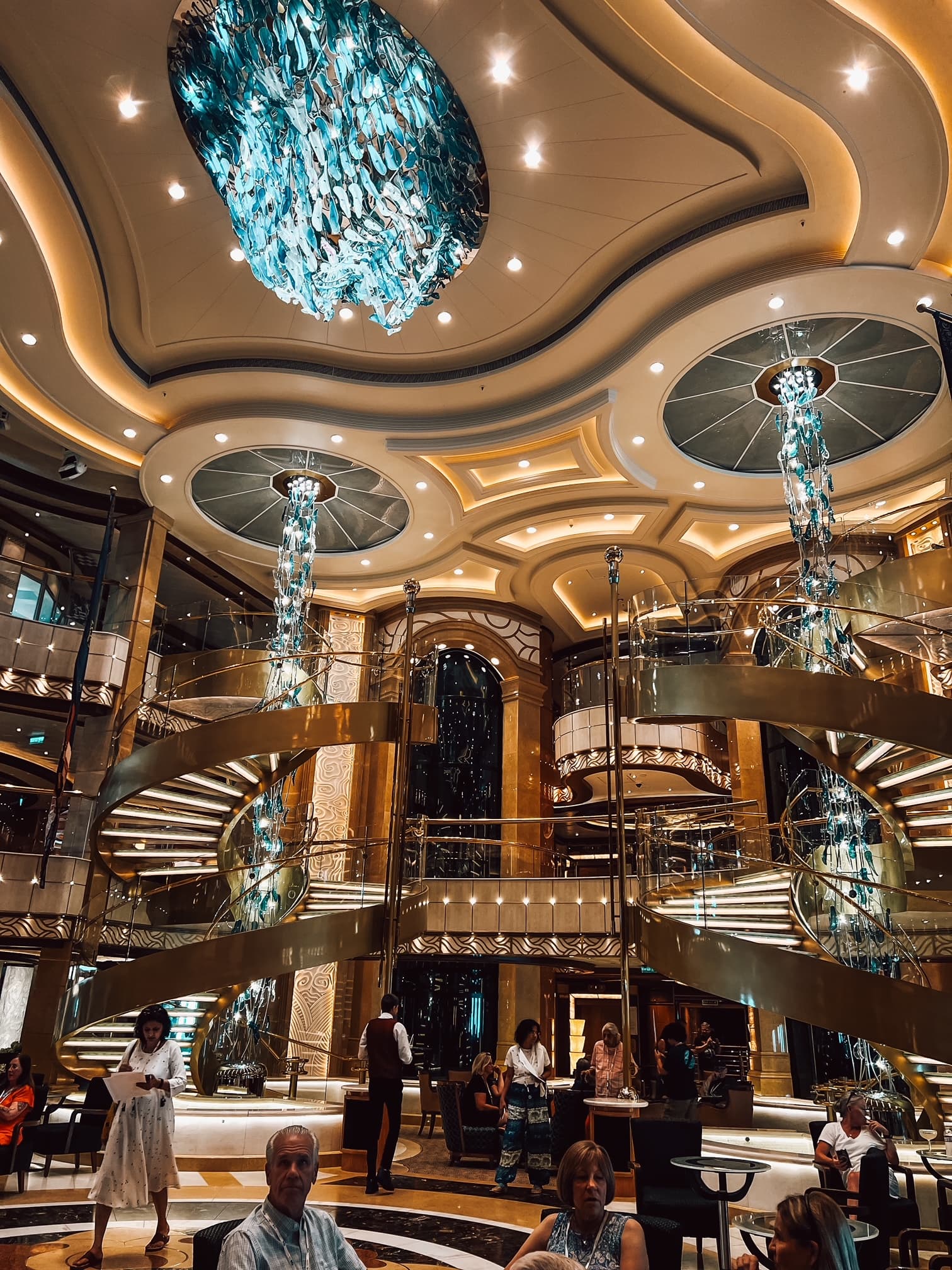 The ship piazza descends up two floors with spiral staircases with crystal chandeliers.