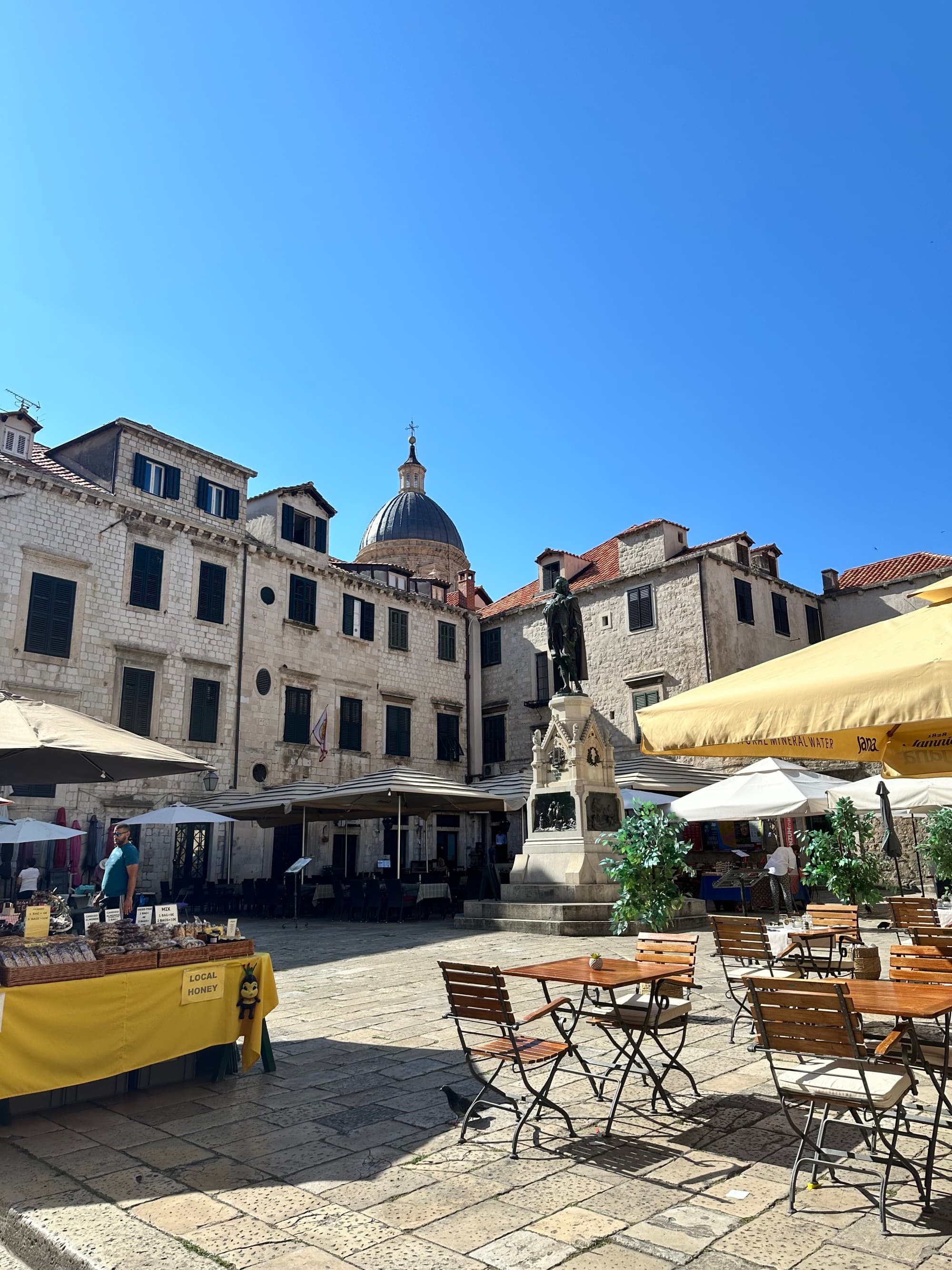 The outdoor patio of a restaurant on a sunny day.