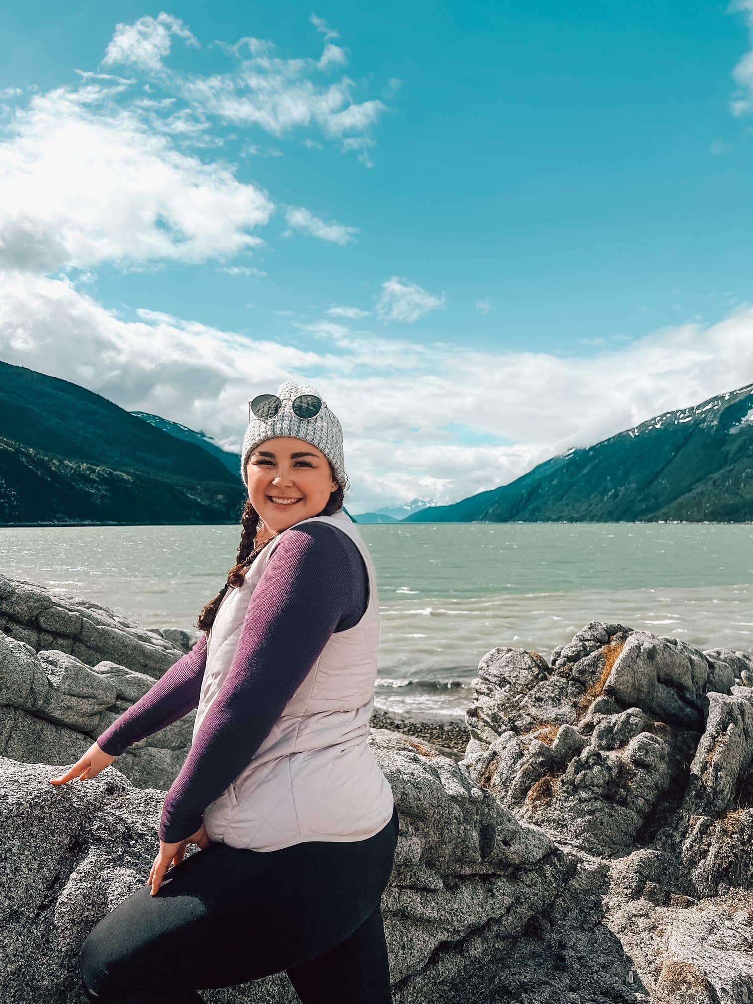 Yakutania Point Skagway in front of crystal-clear waters on a sunny day.