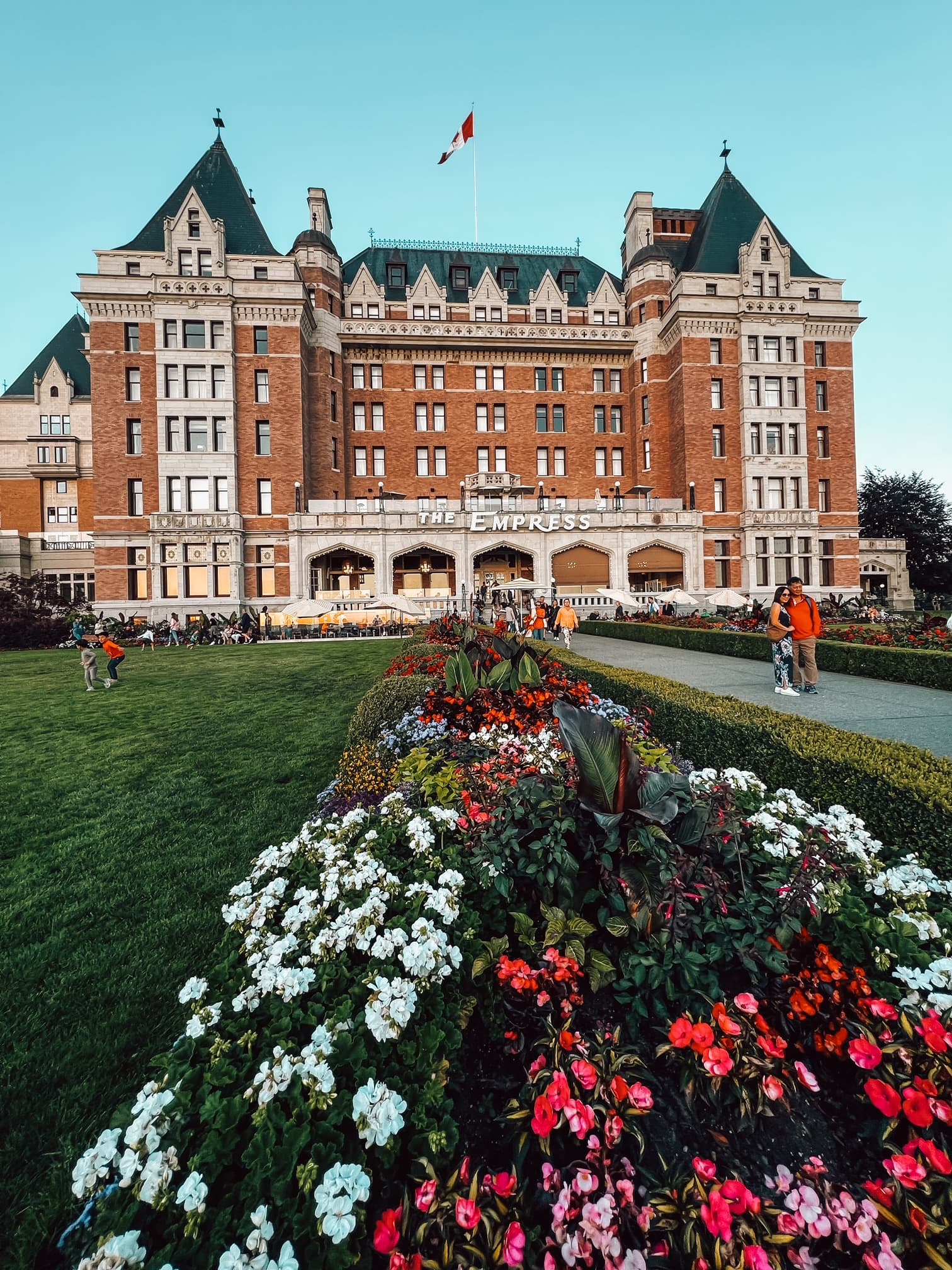 A view of the Empress Hotel from the sprawling grass and flower beds.