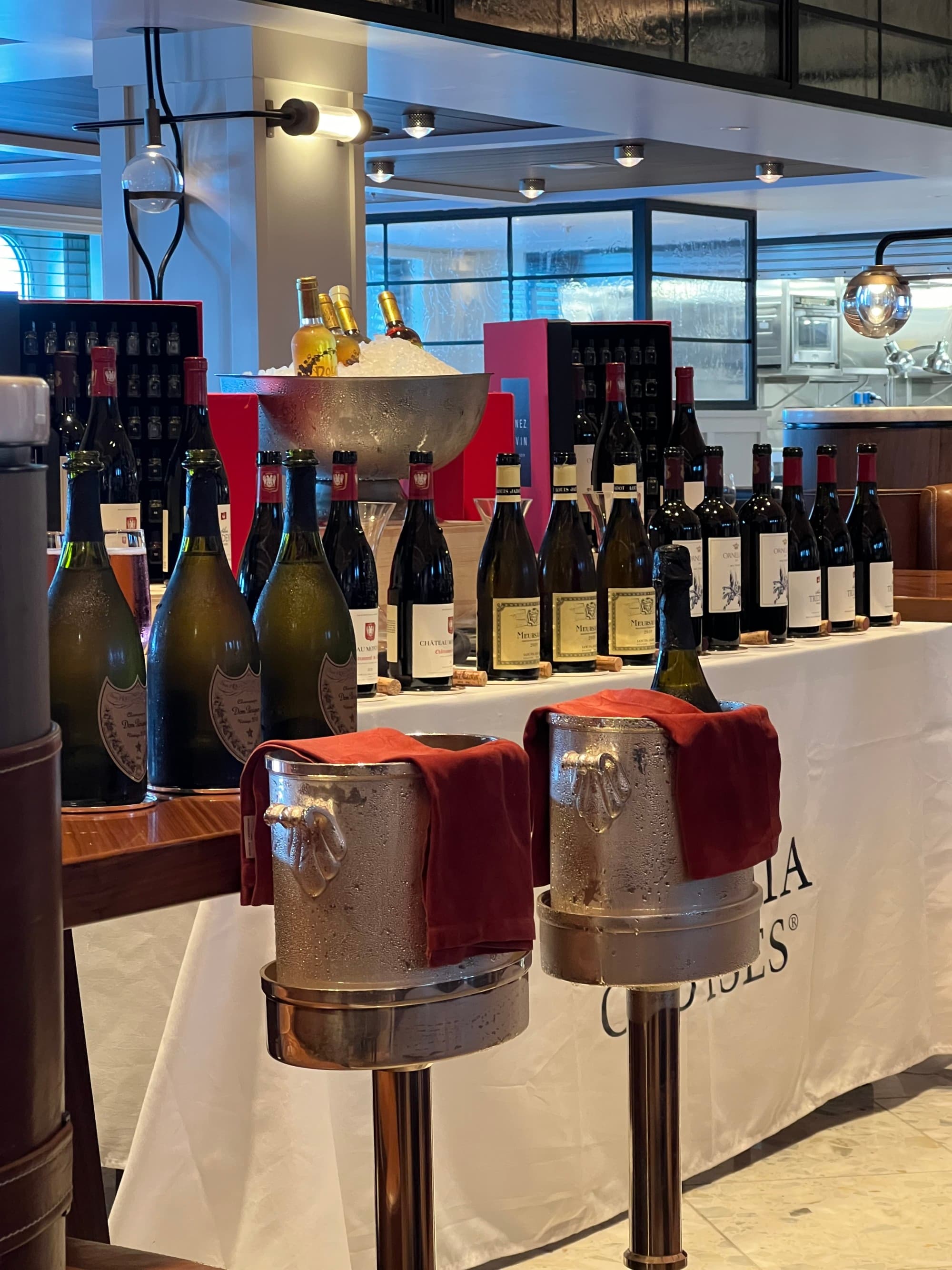 Wine bottles lined up on a bar