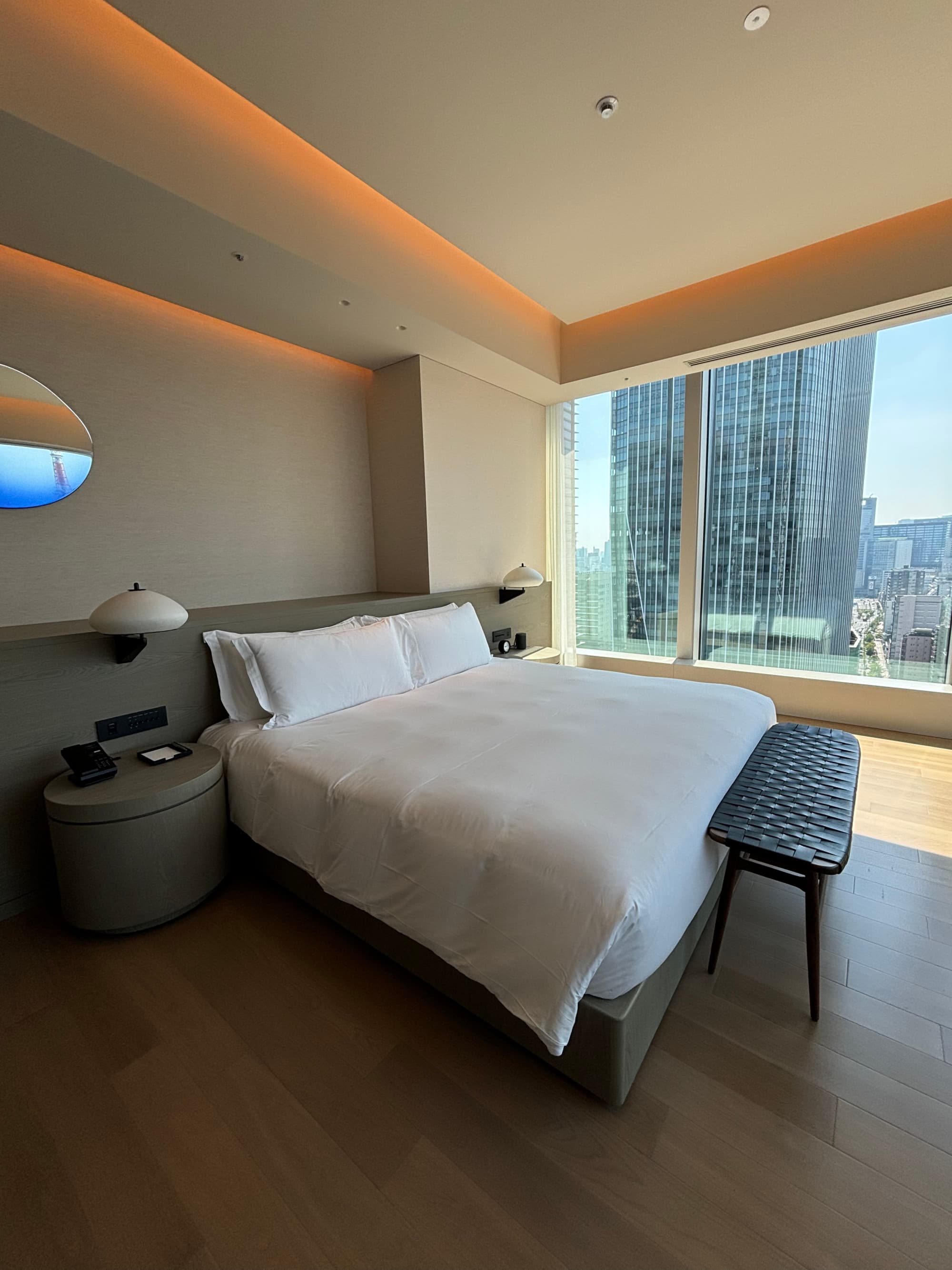 A large white bed in a hotel room