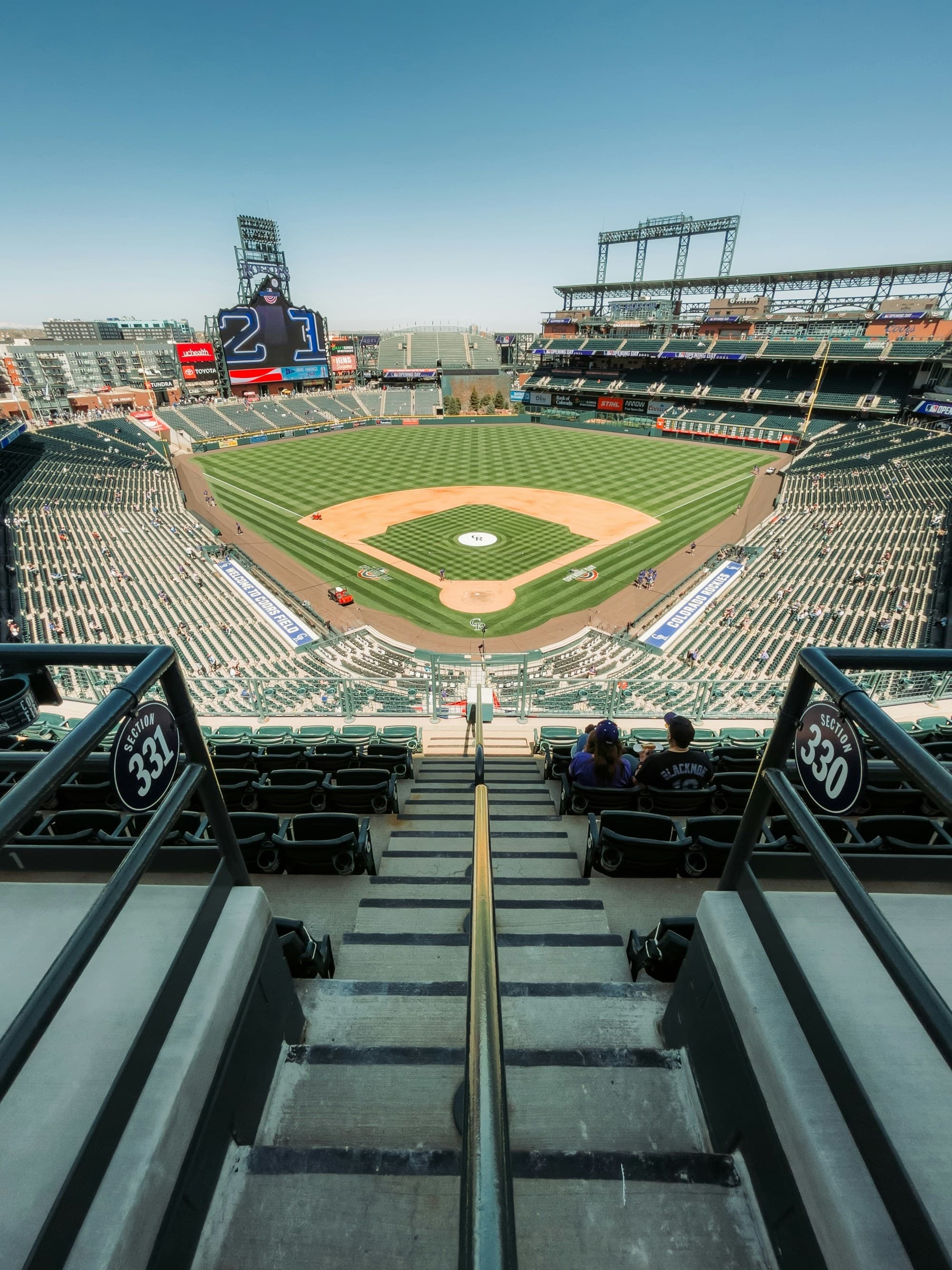 An expansive baseball stadium from above showcased the field and filled spectator seats.