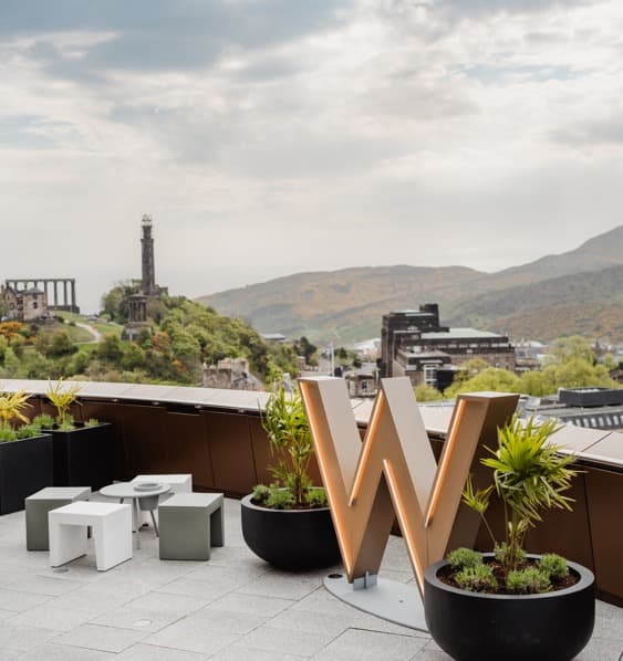 View of the city from W Edinburgh with a gold W sign on the roof.