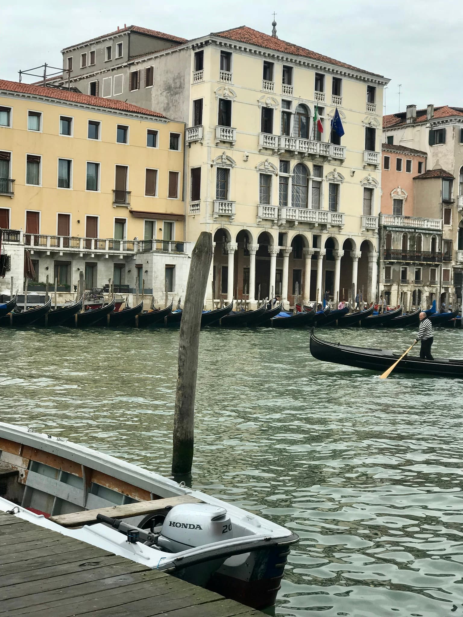 Water body with buildings in the background.