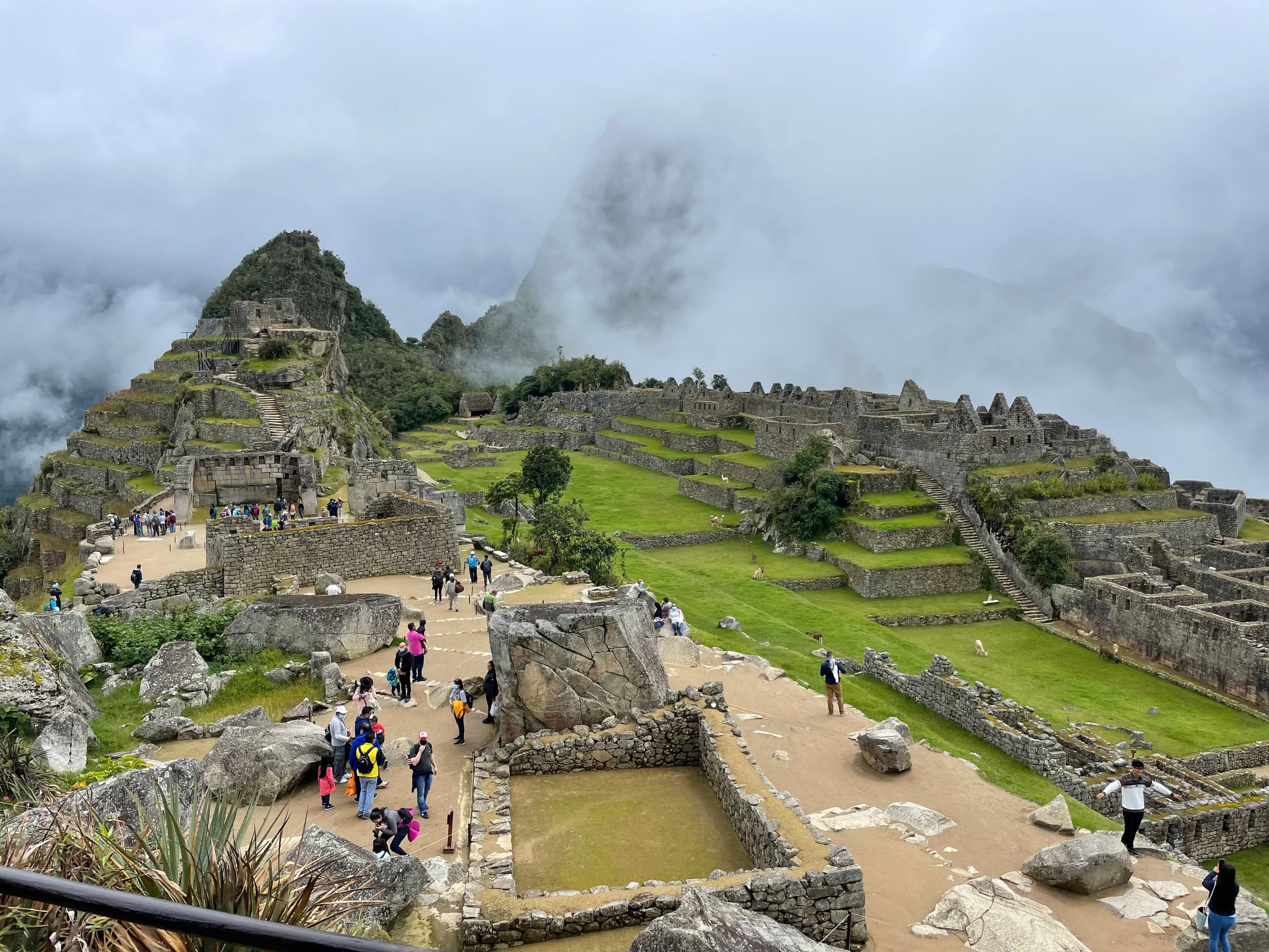 Stone structures and grass at Machu Picchu on a cloudy day