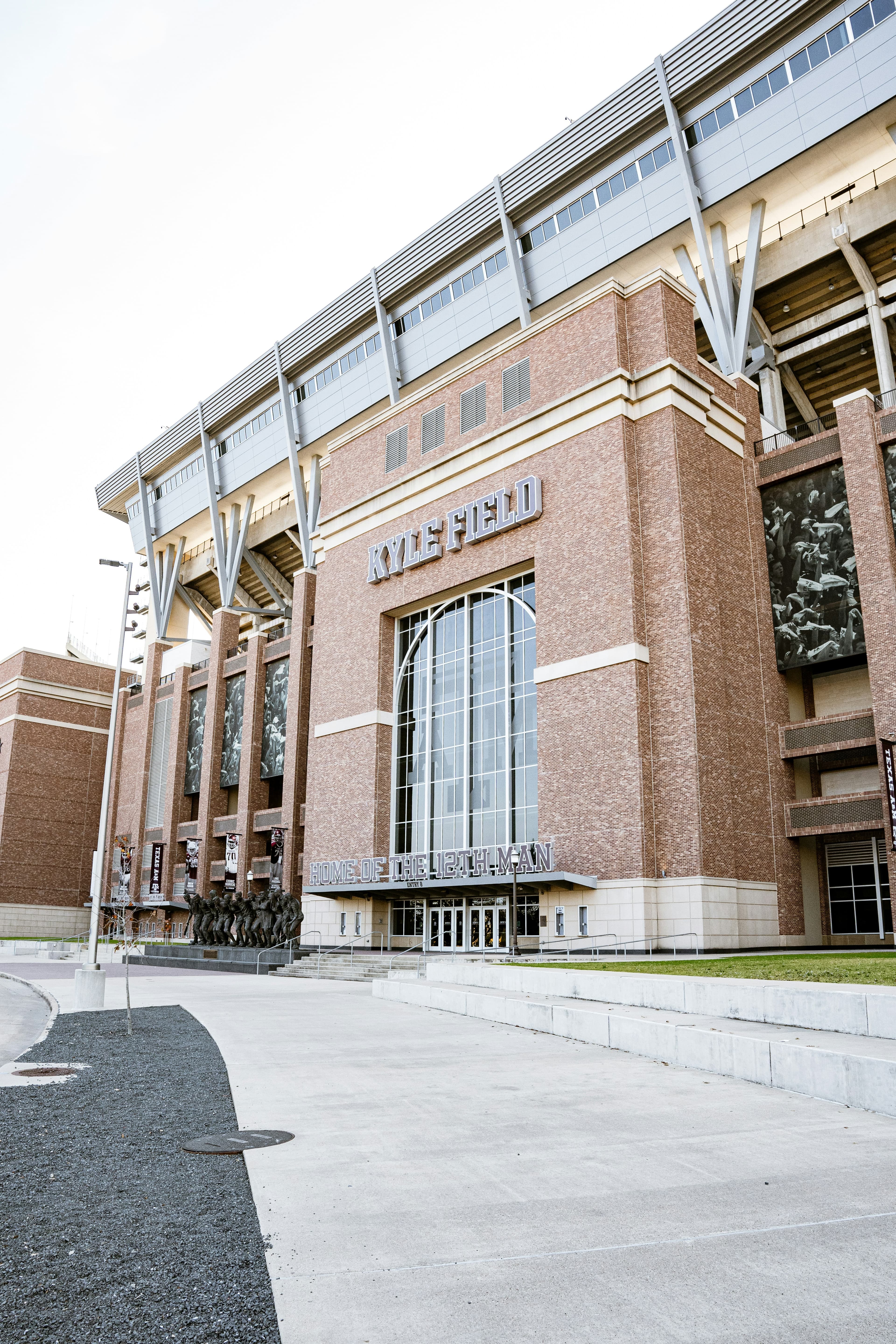 A large brick building with a sign reading "Kyle Field"