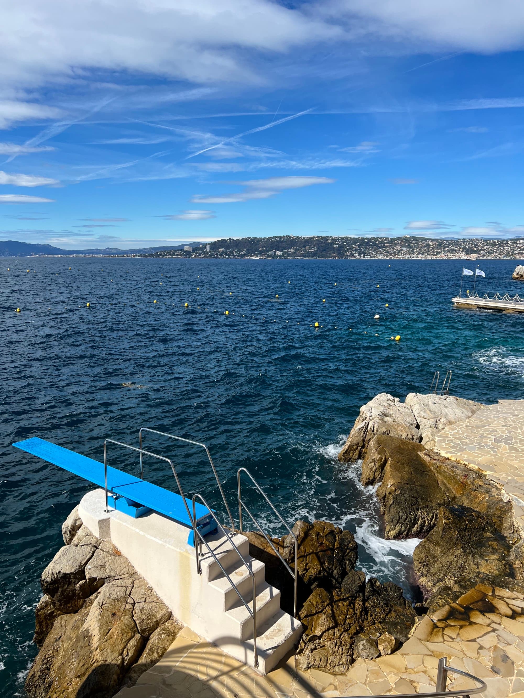 Diving board with steps on a cliff by the ocean