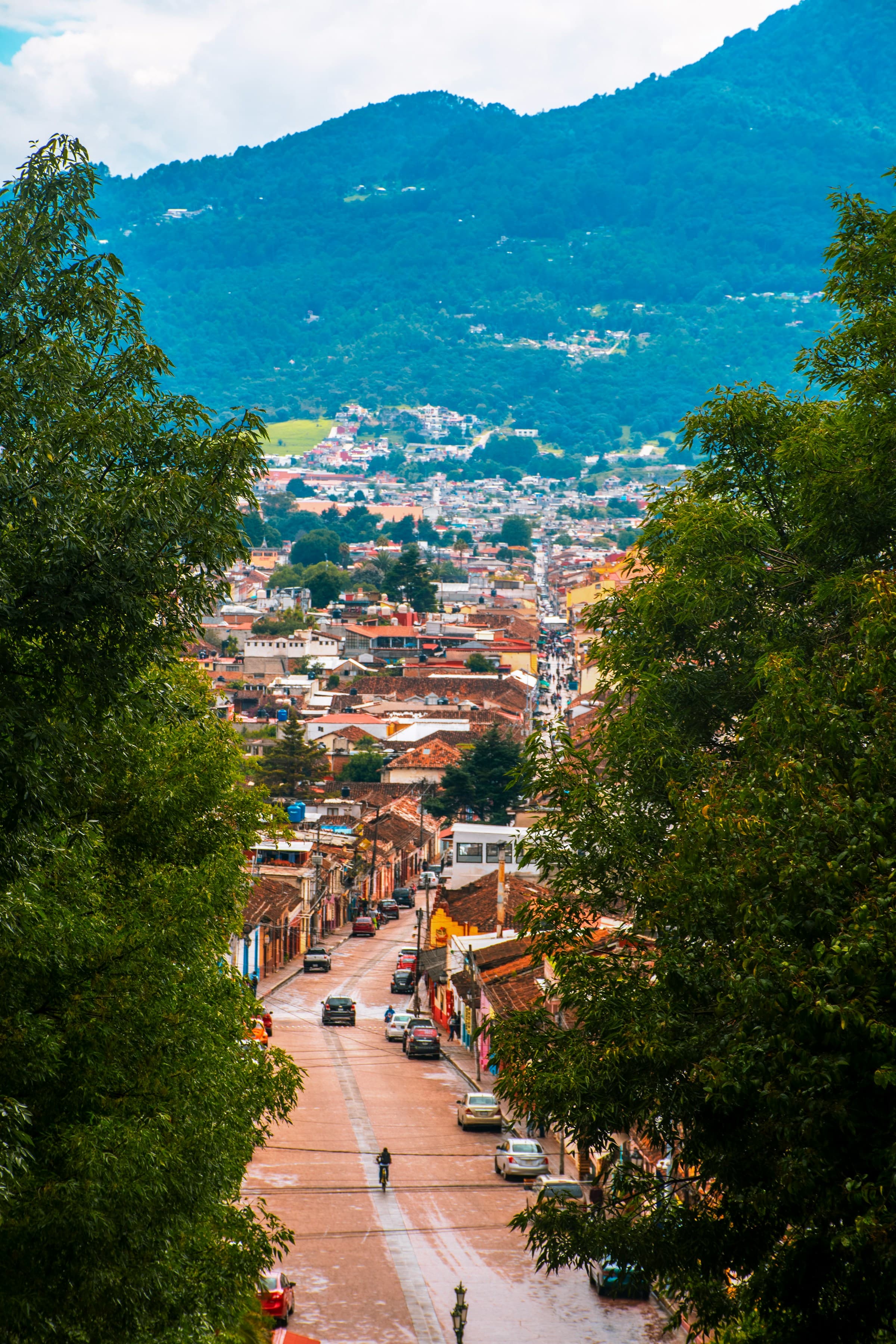 An aerial view of a small, country road leading the way to San Cristobal de las Casas.