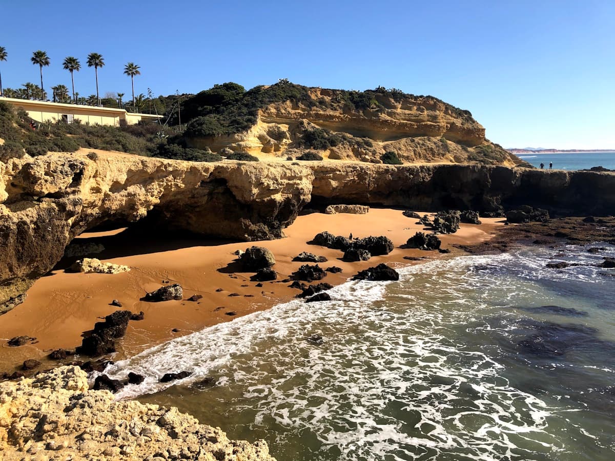 A rocky beach next to a body of water