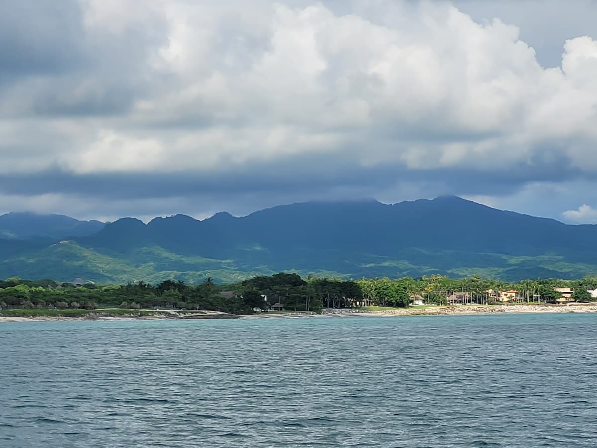 Mountain View Of The Shoreline From A Fishing Boat