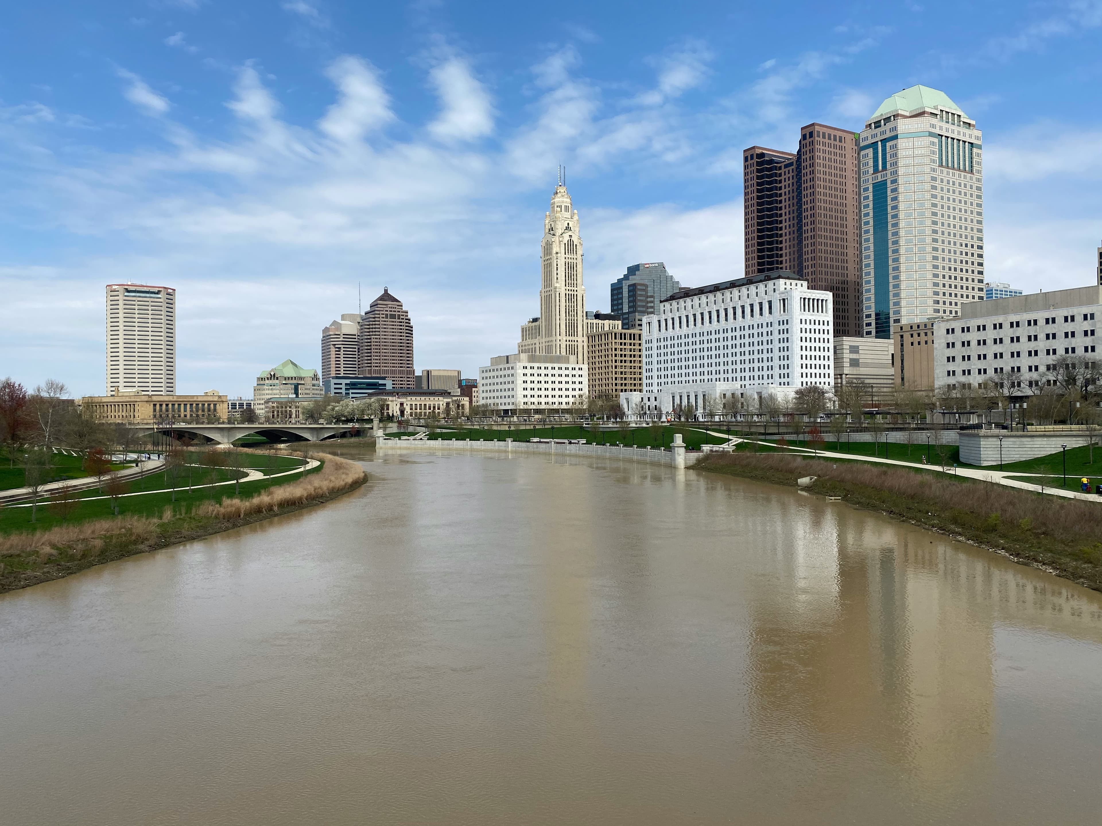 City skyline during day time with cloudy sky.