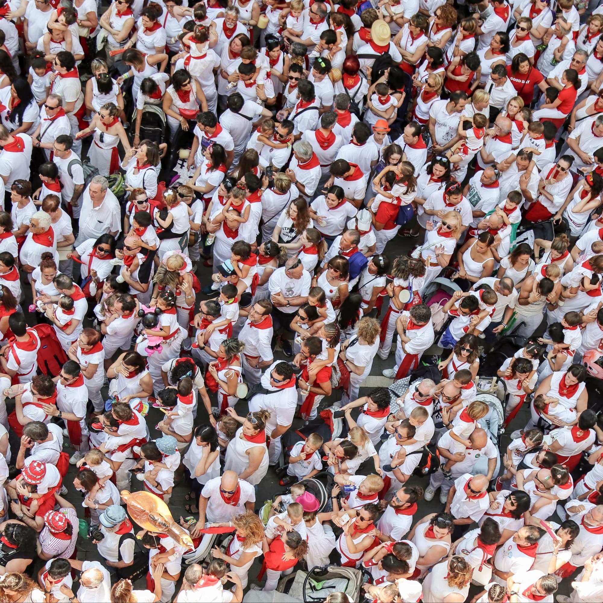 An aerial view of the people standing in a crowd for running of the bulls.