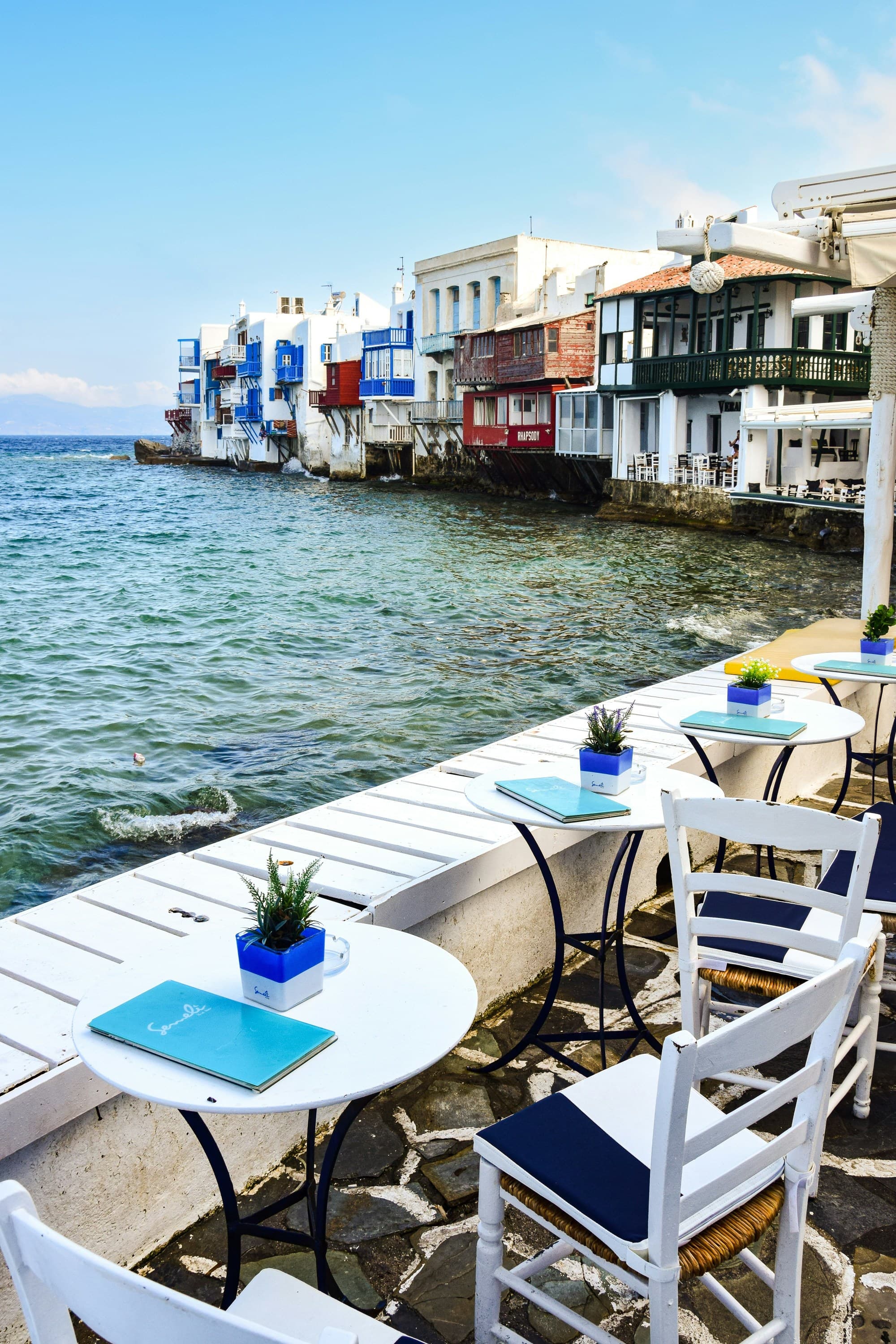 An outdoor restaurant near the sea during daytime.