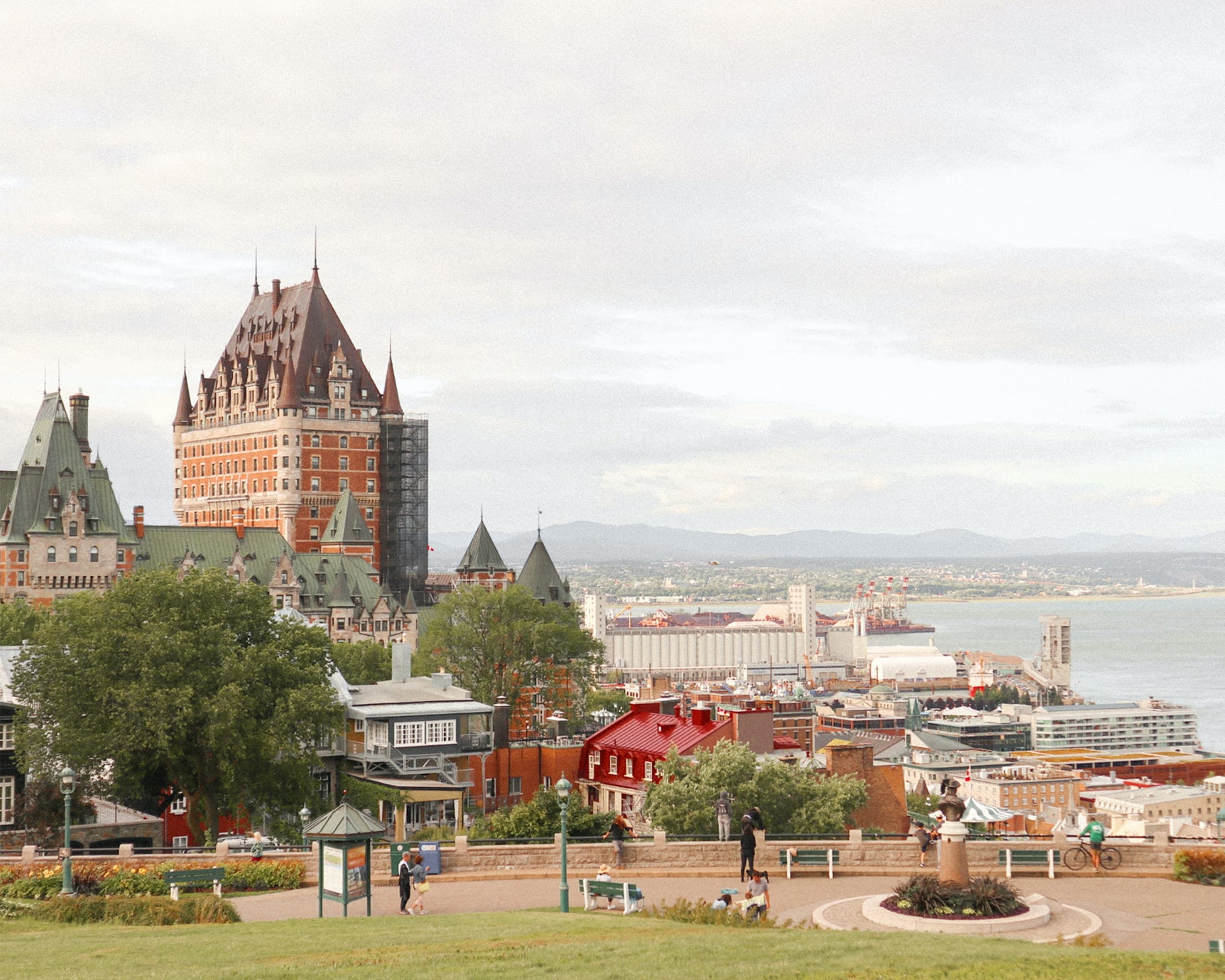 Quebec City streets in Canada with white cars and orange green and blue buildings