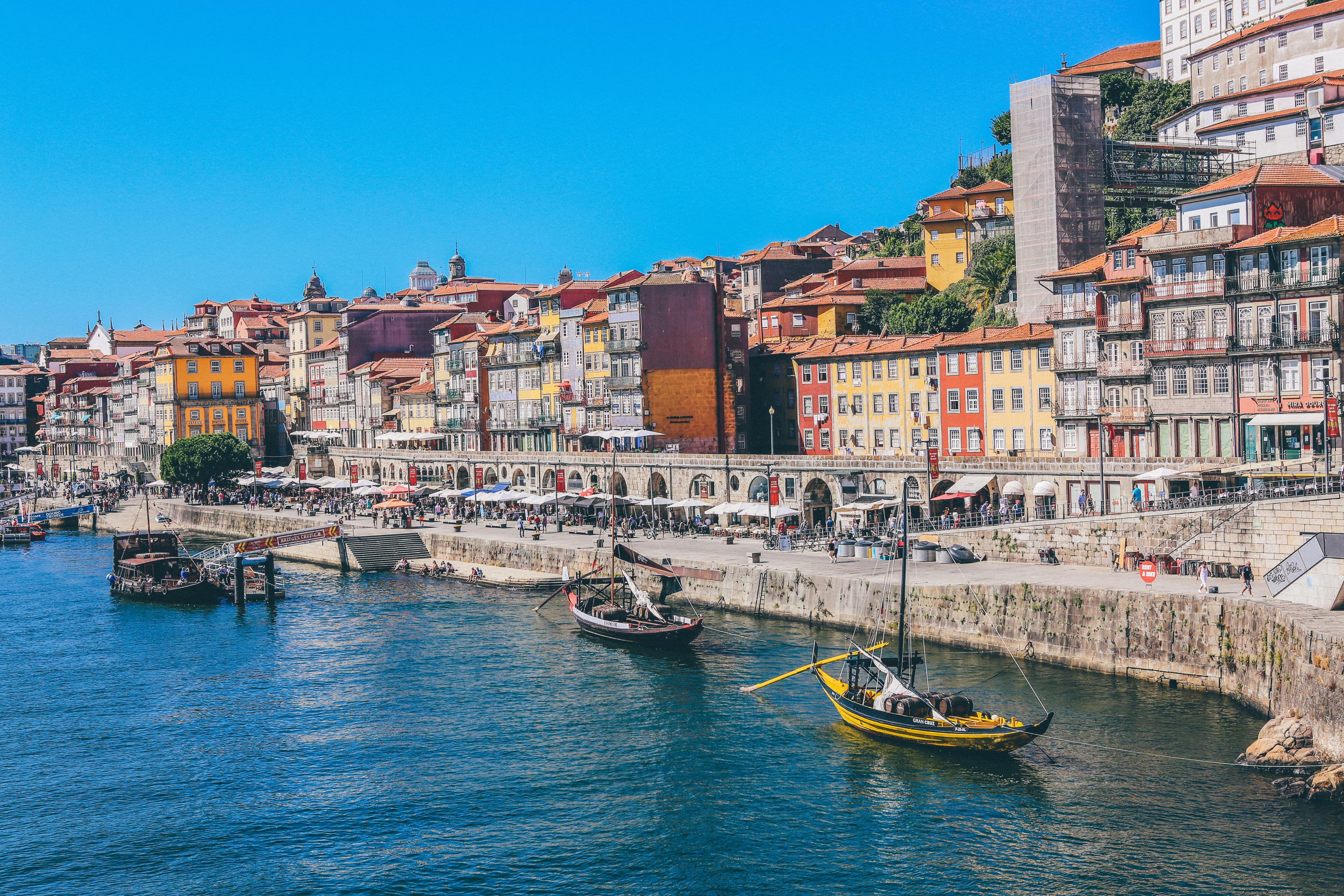 View of boats in the water and colorful houses in Portugal