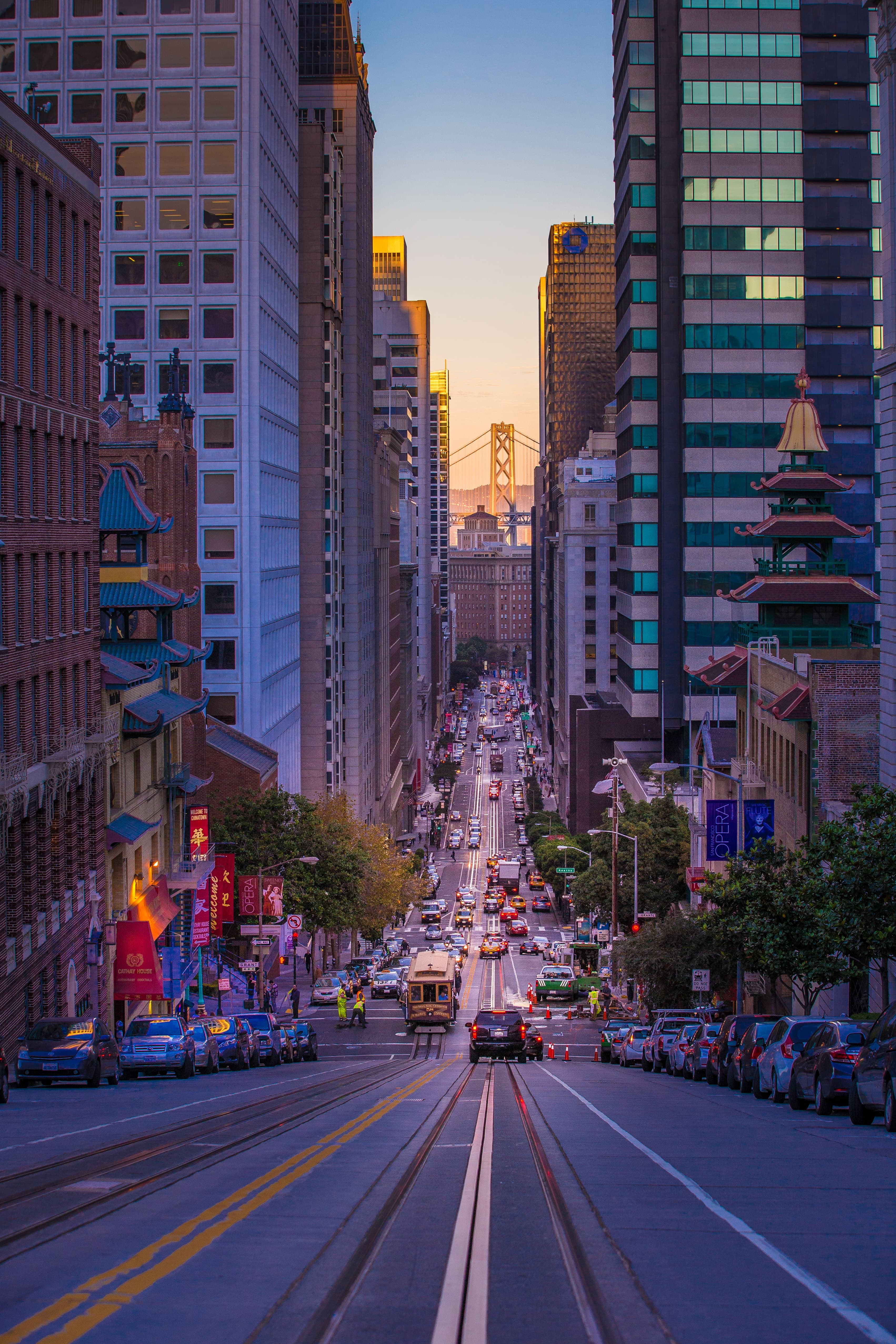 street surrounded by buildings with cars