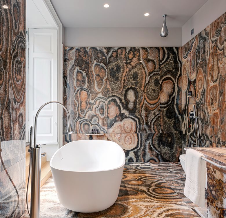 A bathroom with intricately painted walls