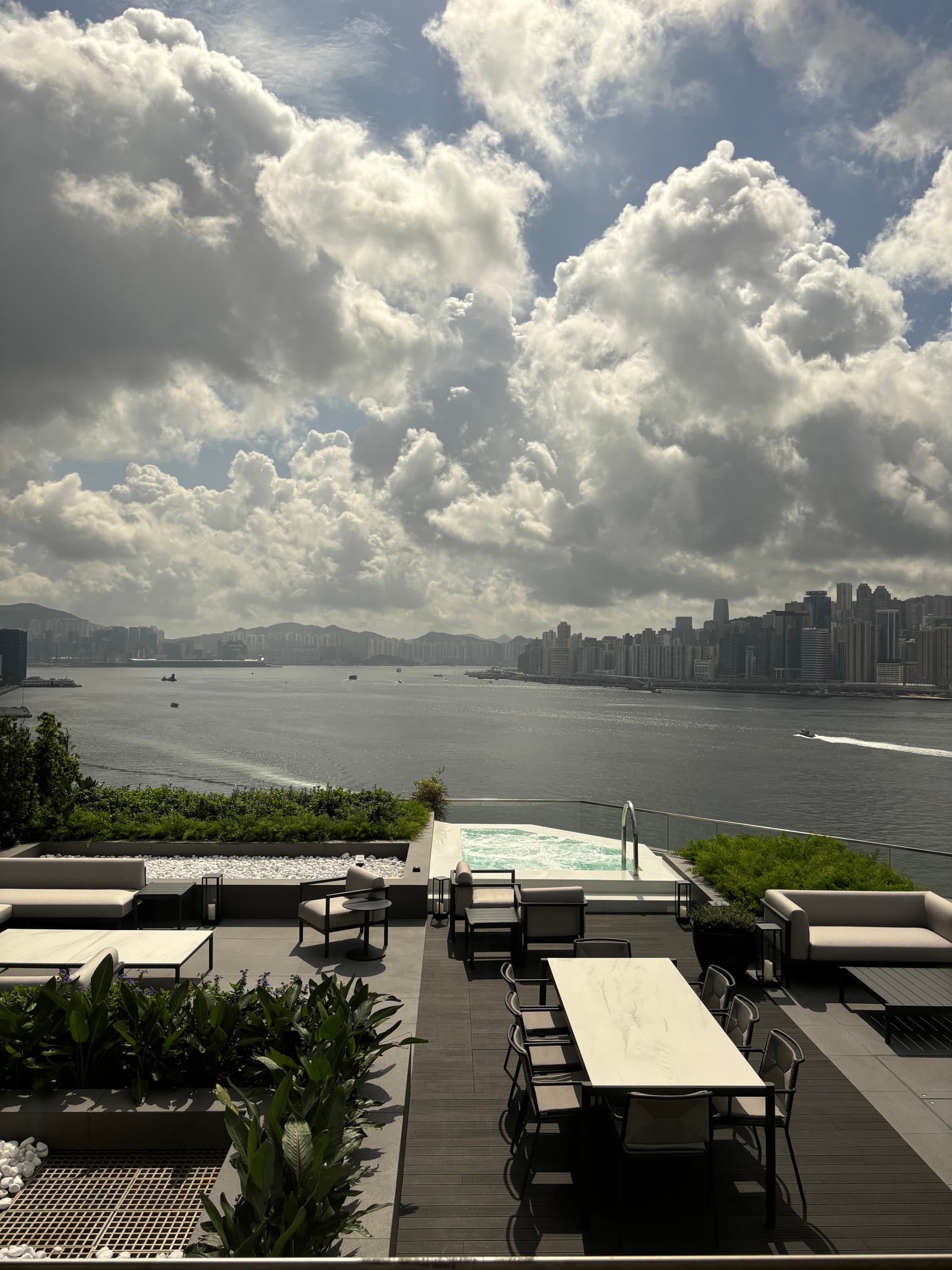 Aerial view of an outdoor patio next to a body of water