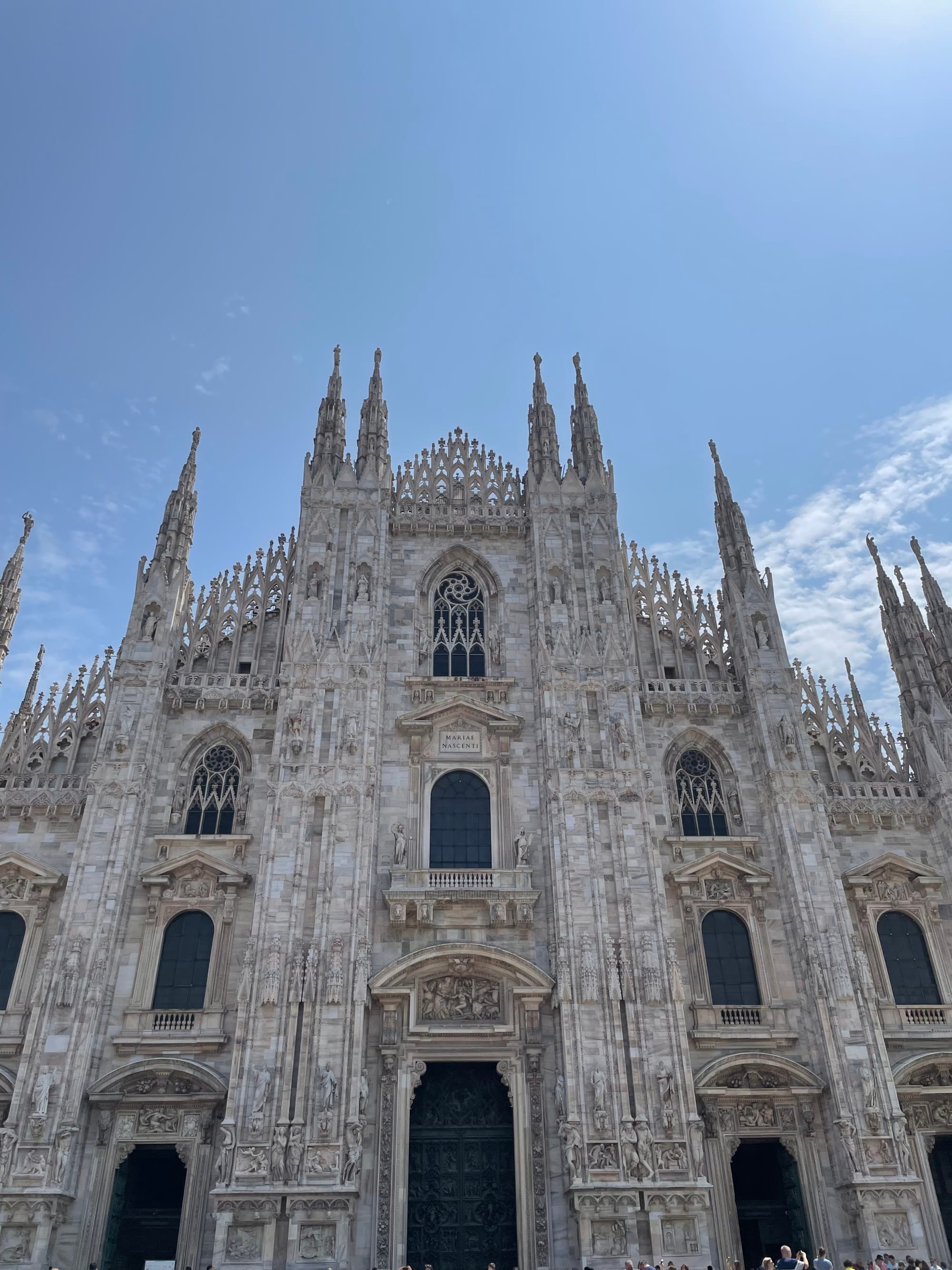 The outside of an intricately designed cathedral building during the daytime