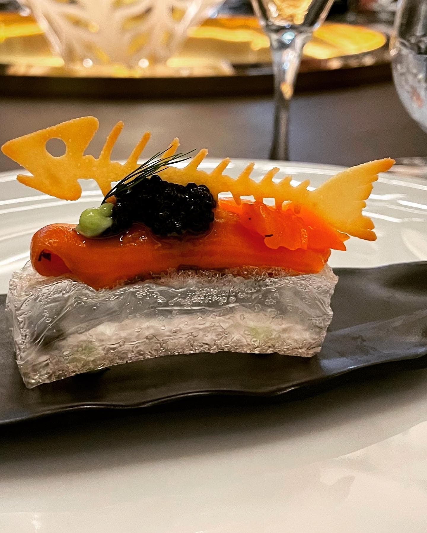 Creatively presented food on a black plate