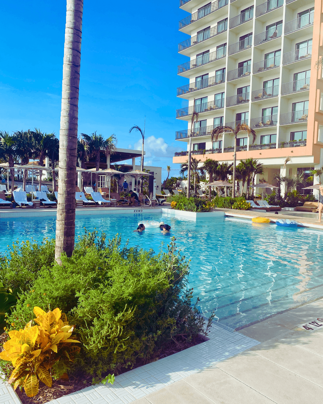 An outdoor swimming pool area during the daytime