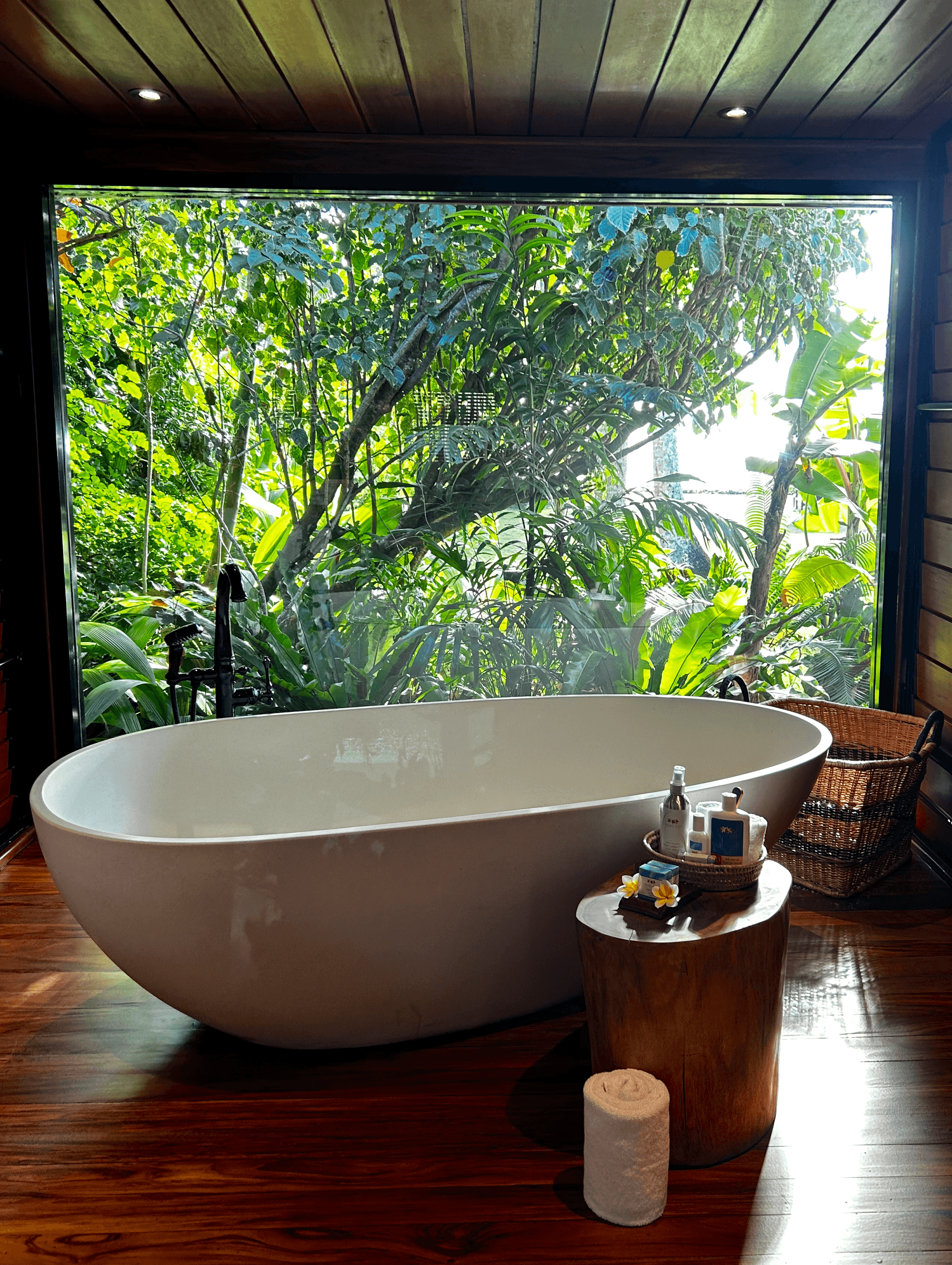 A large bathtub in a hotel bathroom