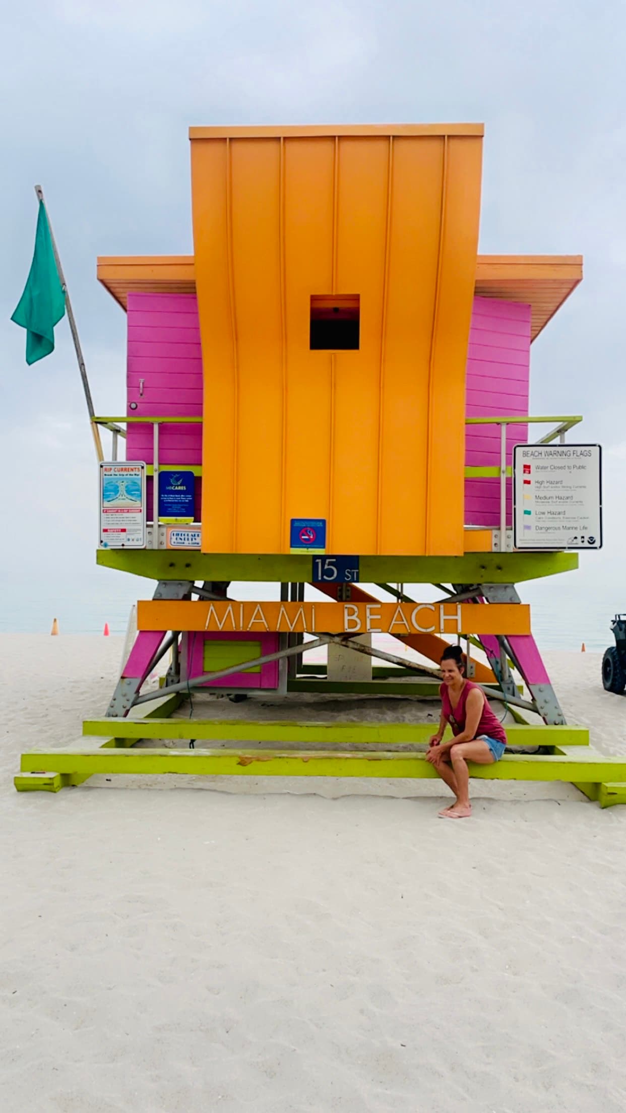 Orange and pink lifeguard tower.