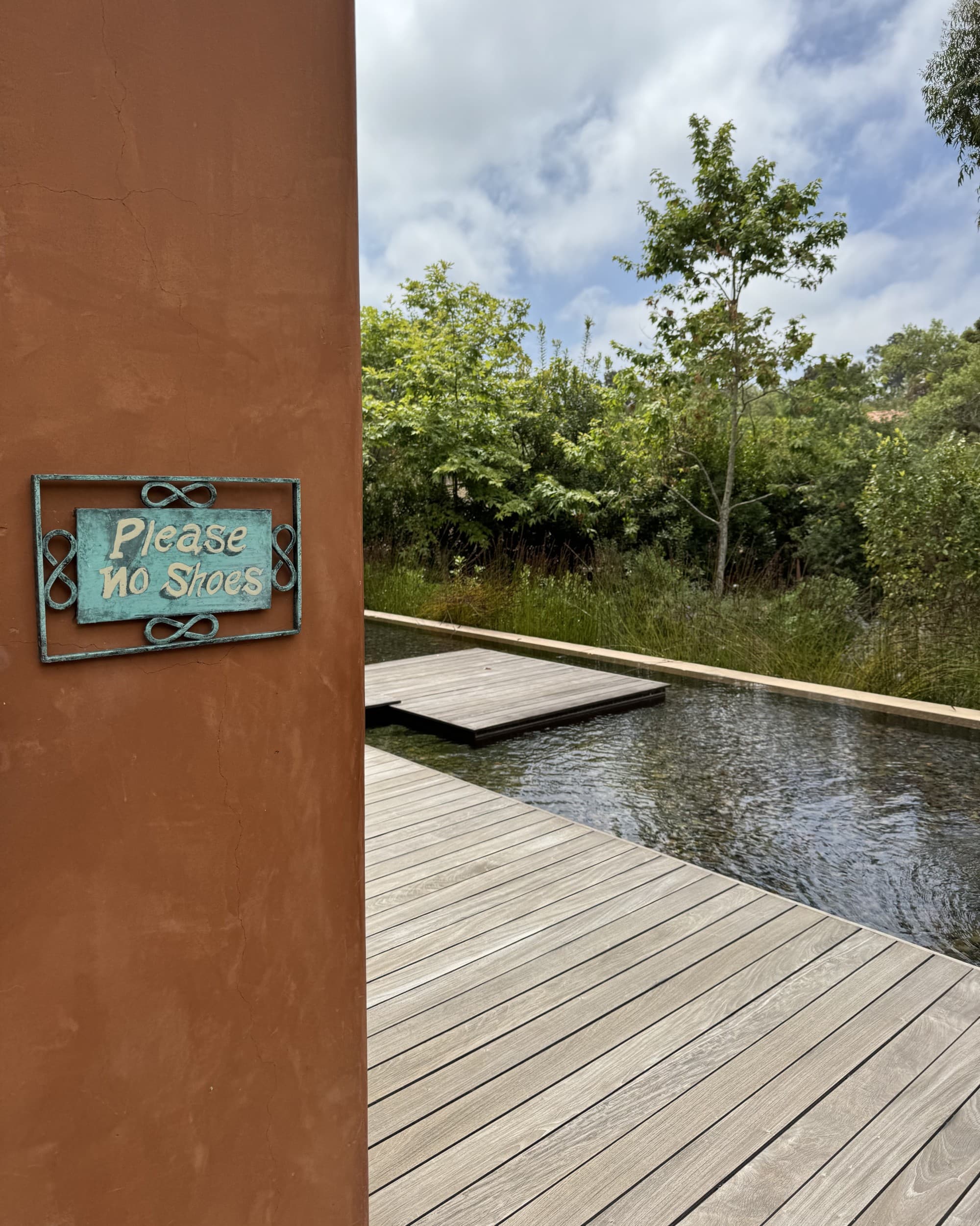 Yoga studio with a pool in the background.