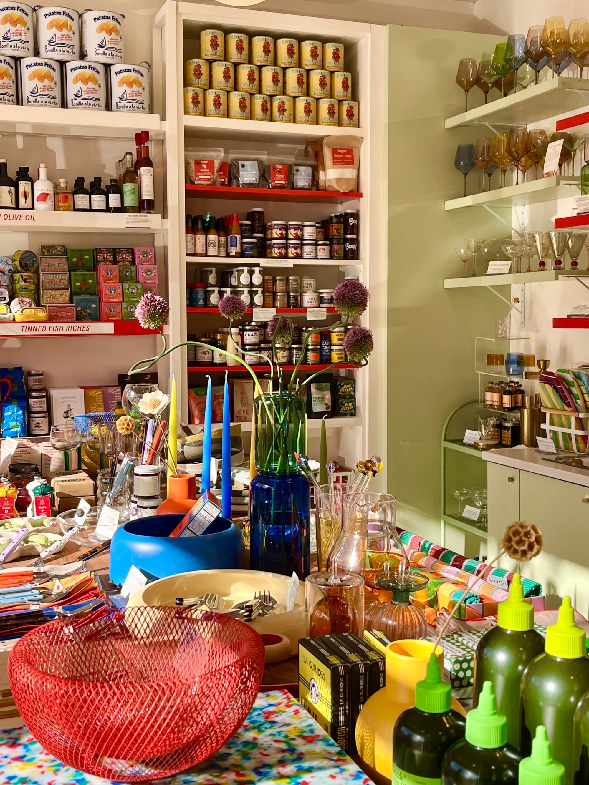 a store filled with colorful home goods and pantry fare