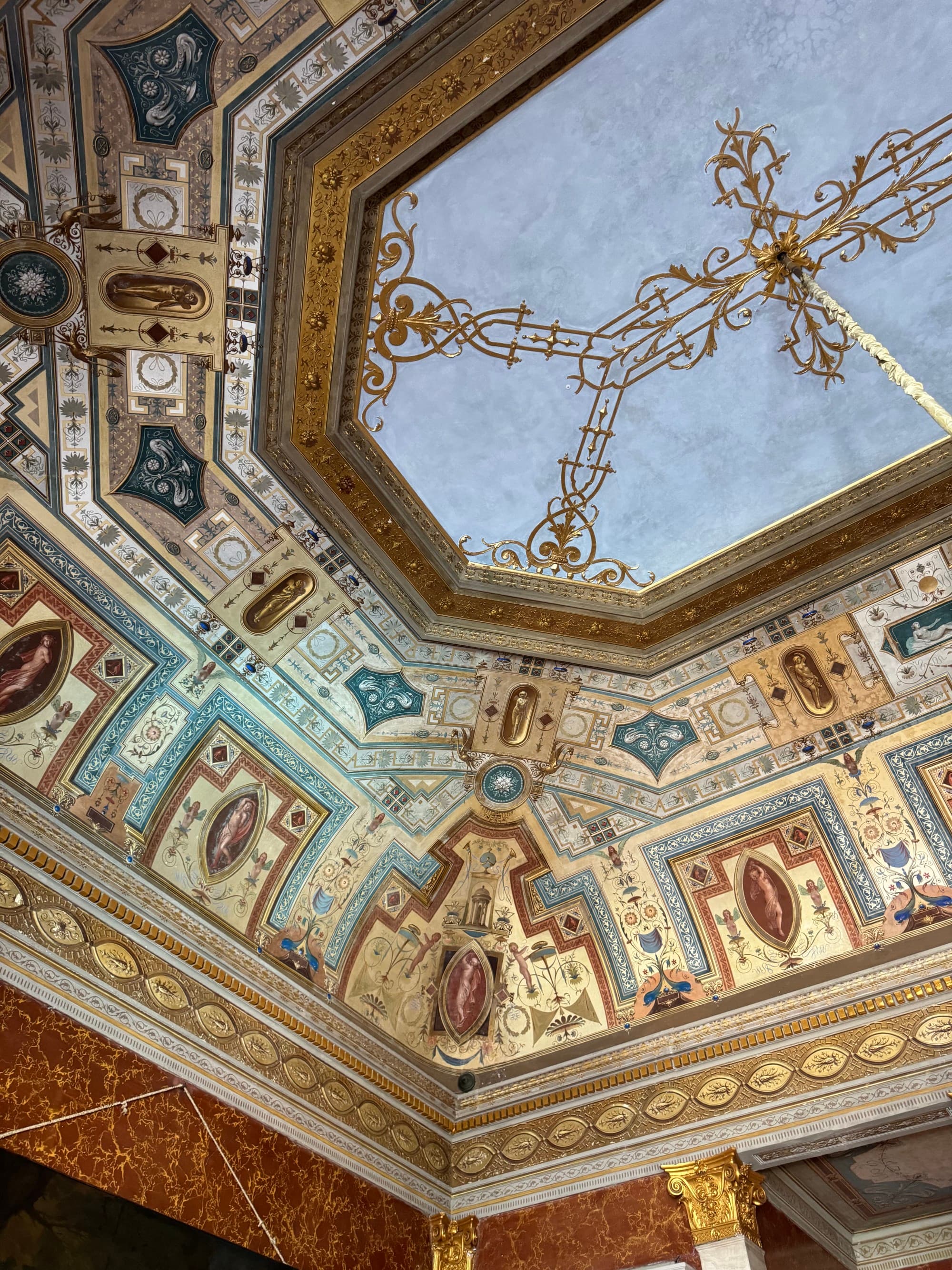 The ceiling of the hotel and a glass-stained skylight.