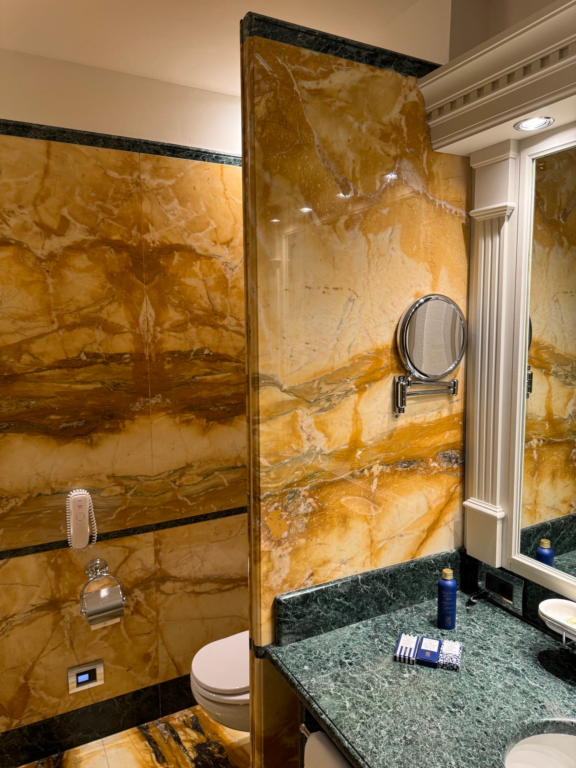 The bathroom features modern amenities in a classic style.