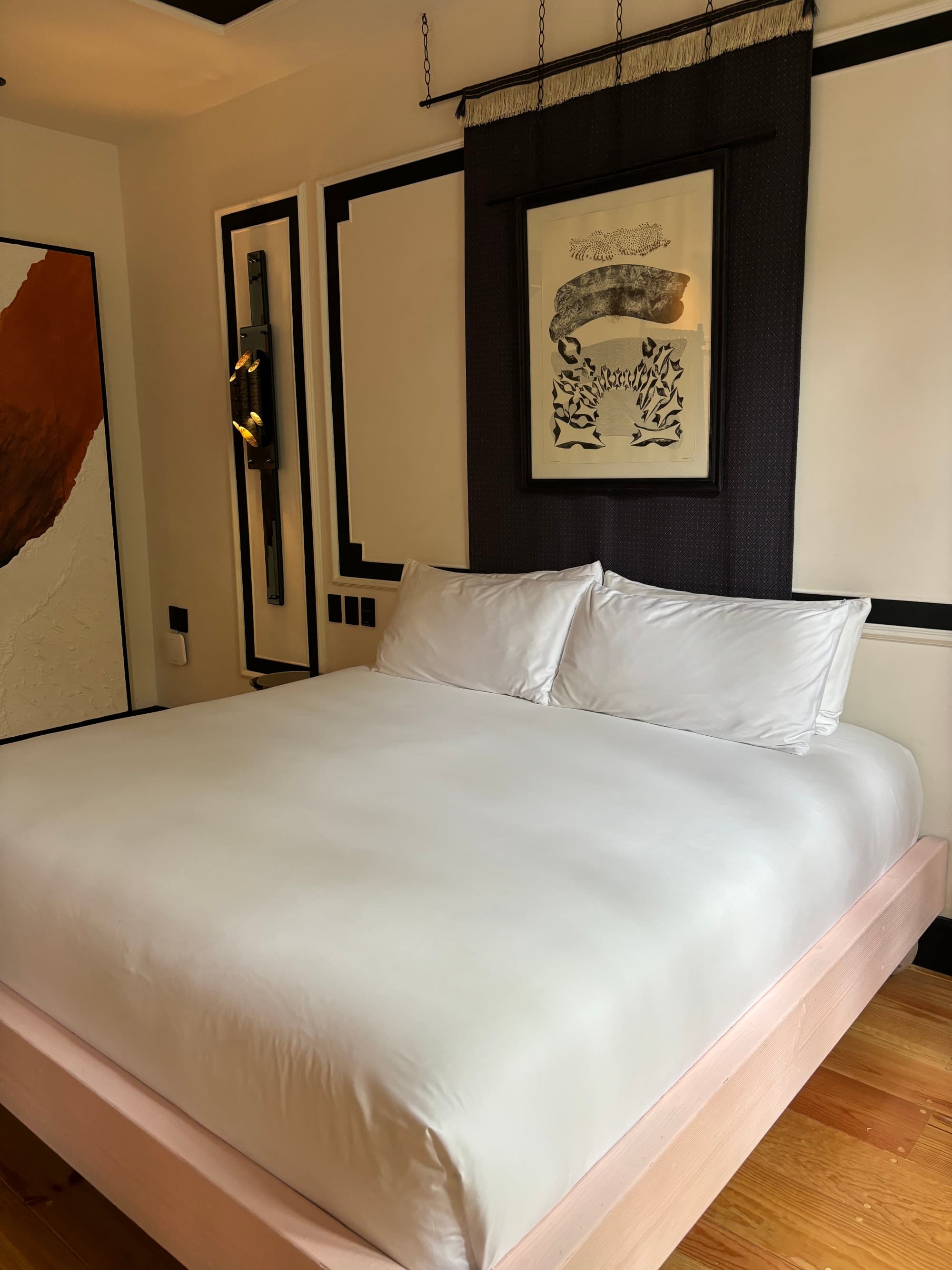 A view of a white bed in a hotel room