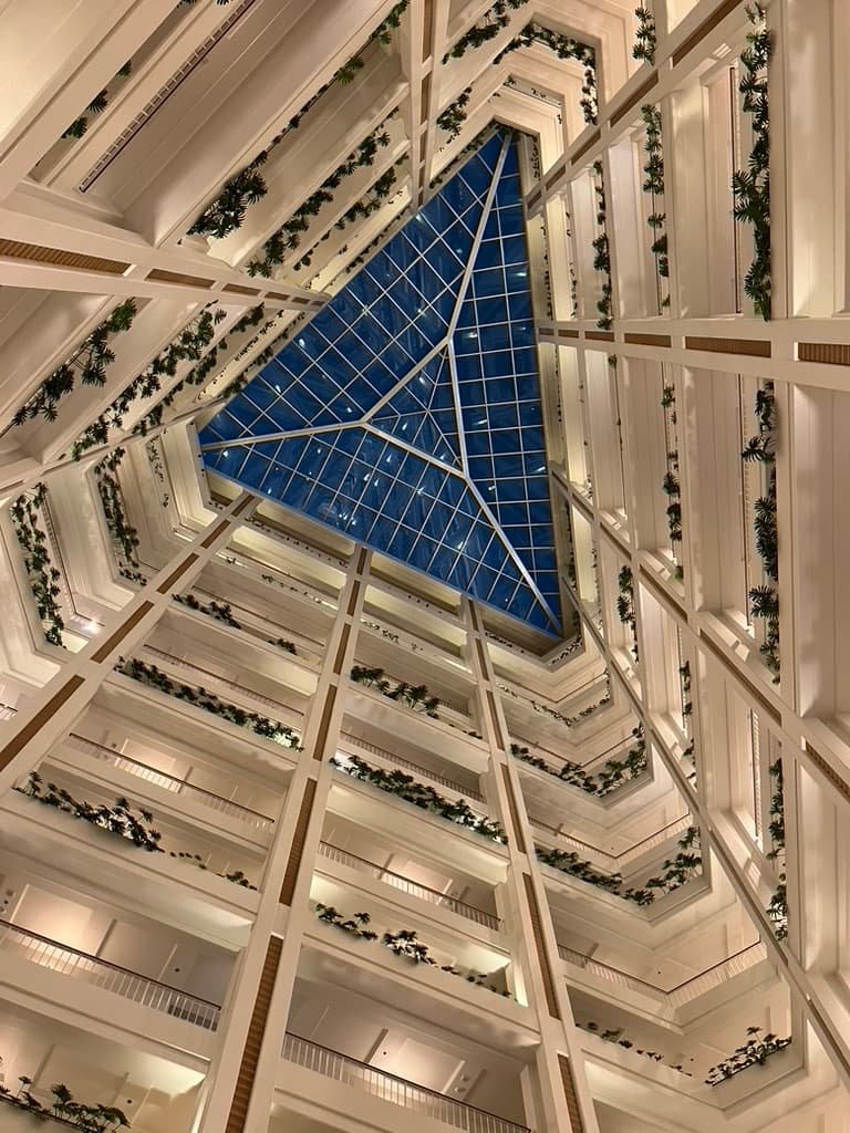 A view from below of the hotel lobby's glass ceiling