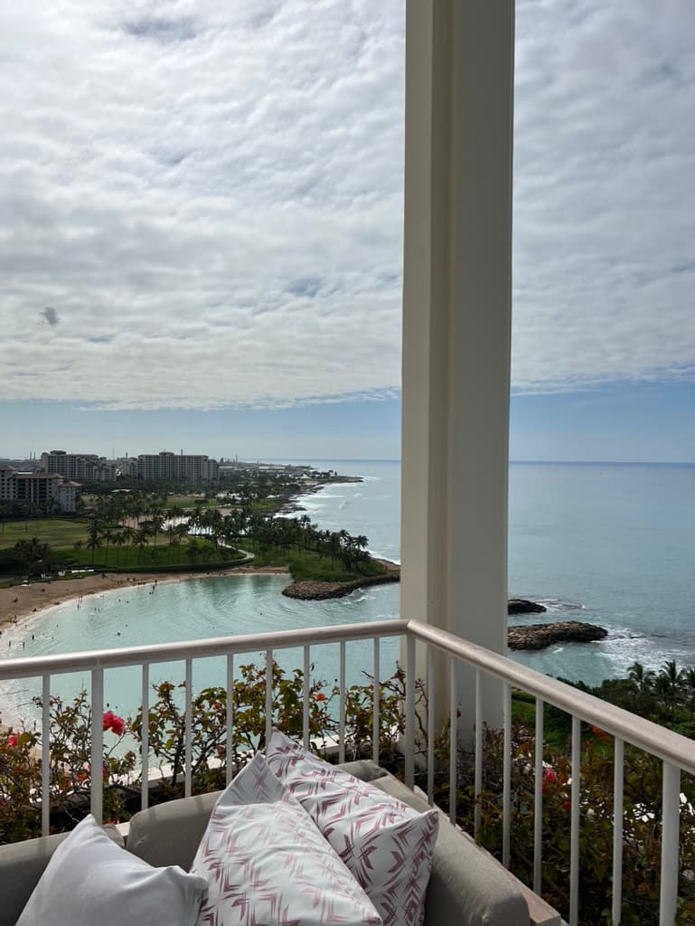 View from a balcony looking out onto the beach below