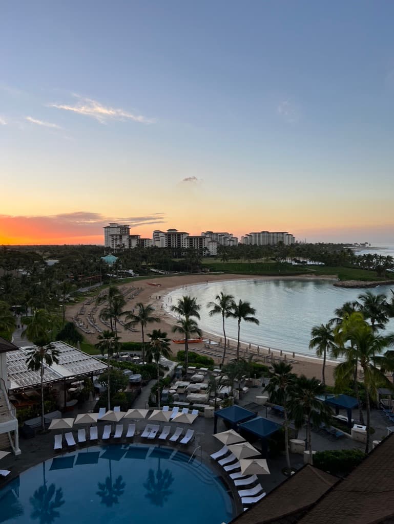 Aerial view of a beach and pool area during the sunset