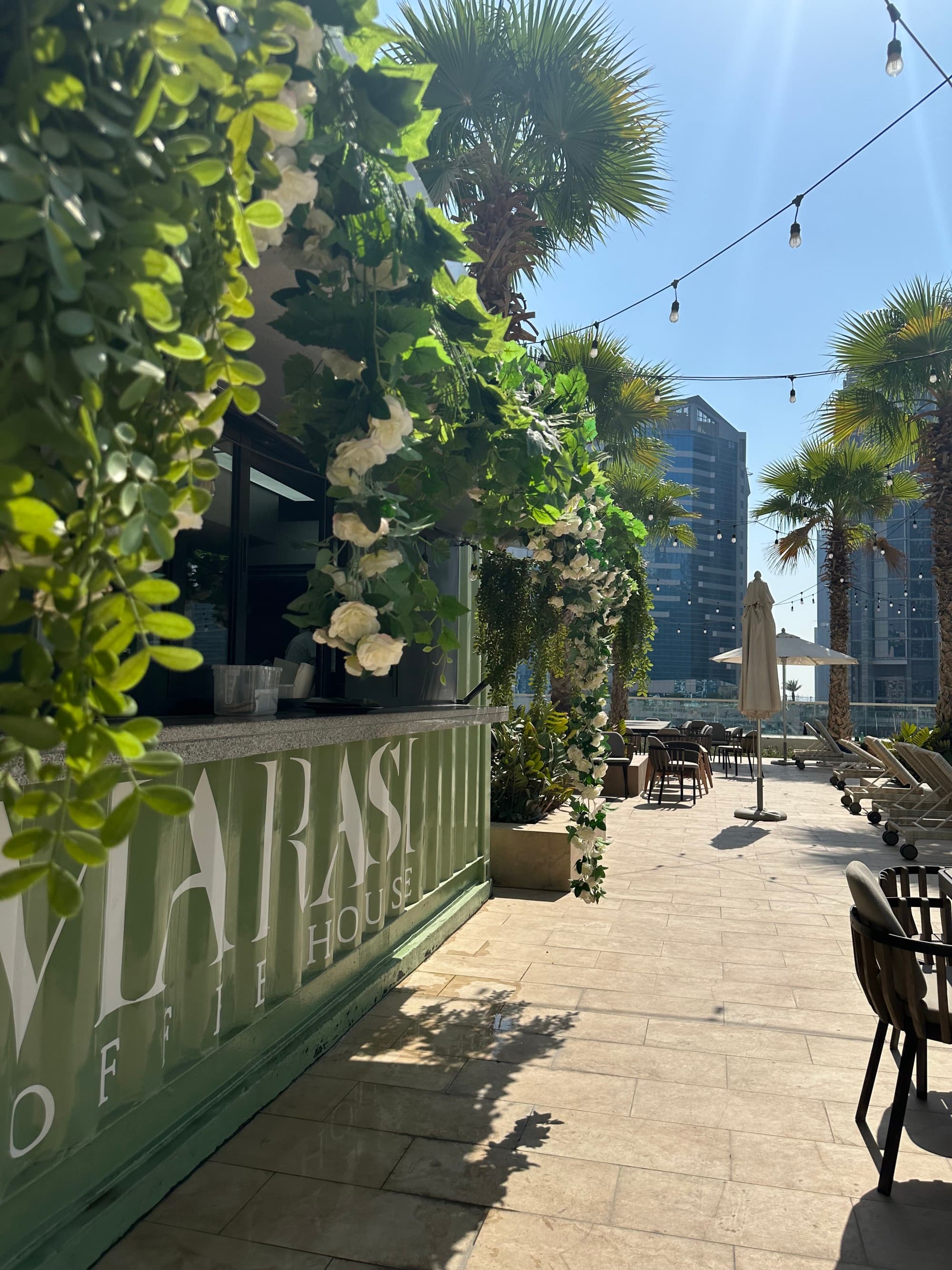 An outside dining area of a cafe during the daytime