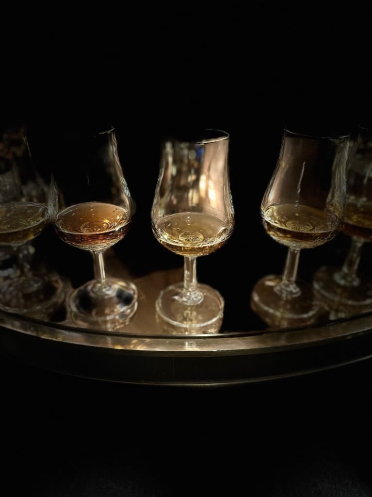 Wine glasses on a table from a wine tasting.