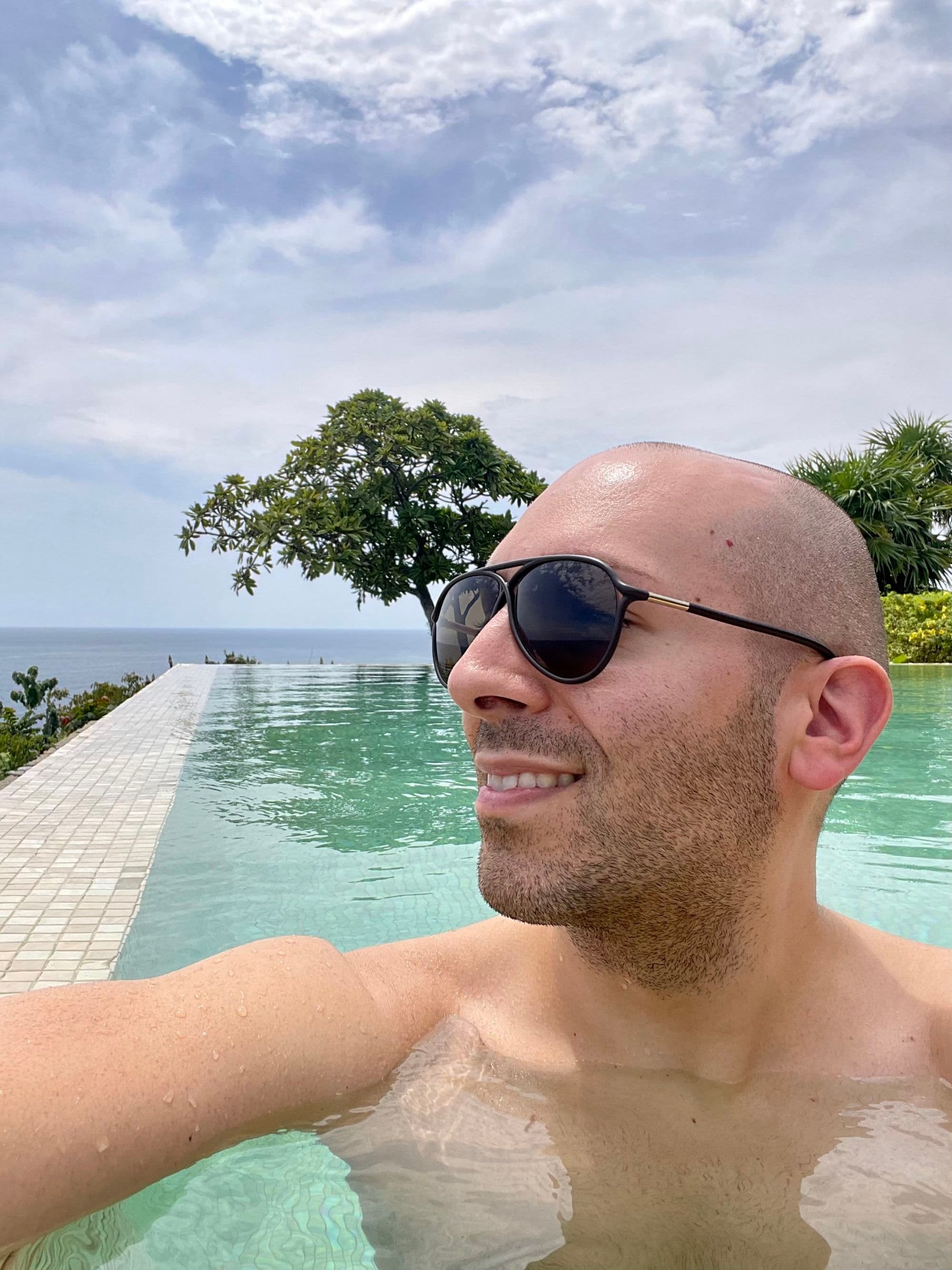 Travel advisor posing in the pool