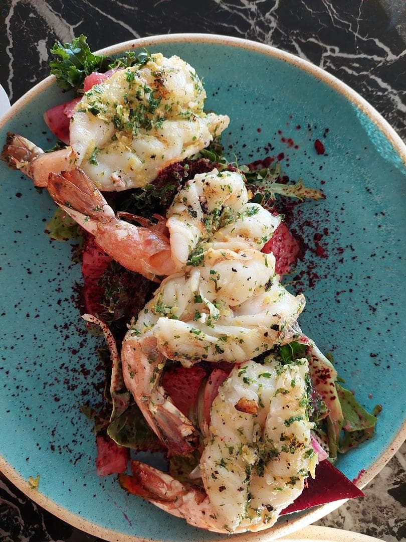 A plate of shrimp on a table.