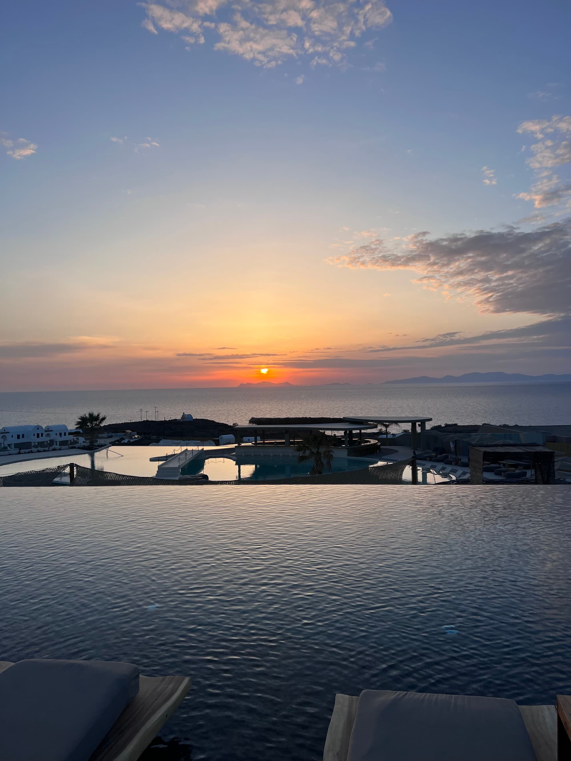 infinity pool overlooking the sea at sunset