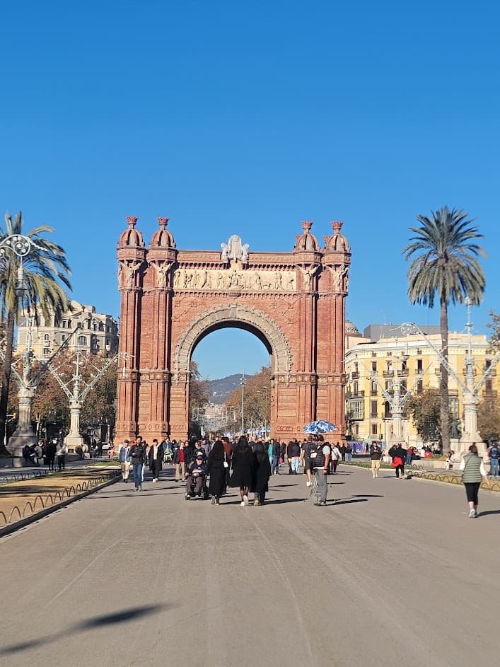 An arched orange structure at the end of a road