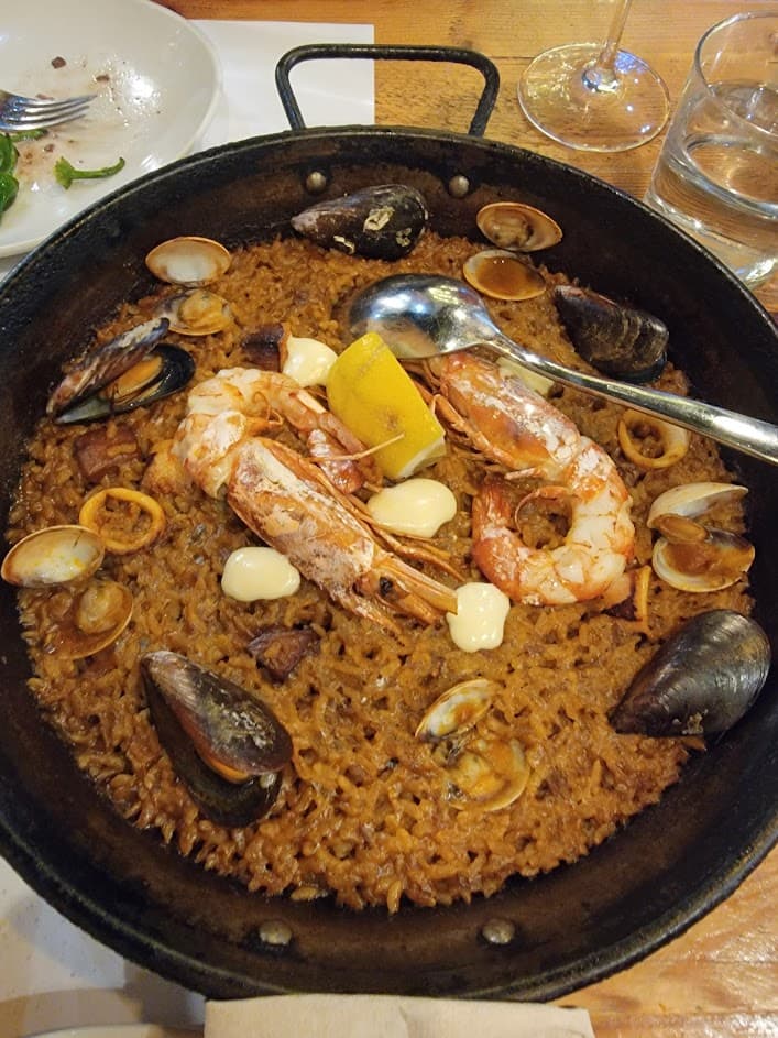 A large pan of seafood paella